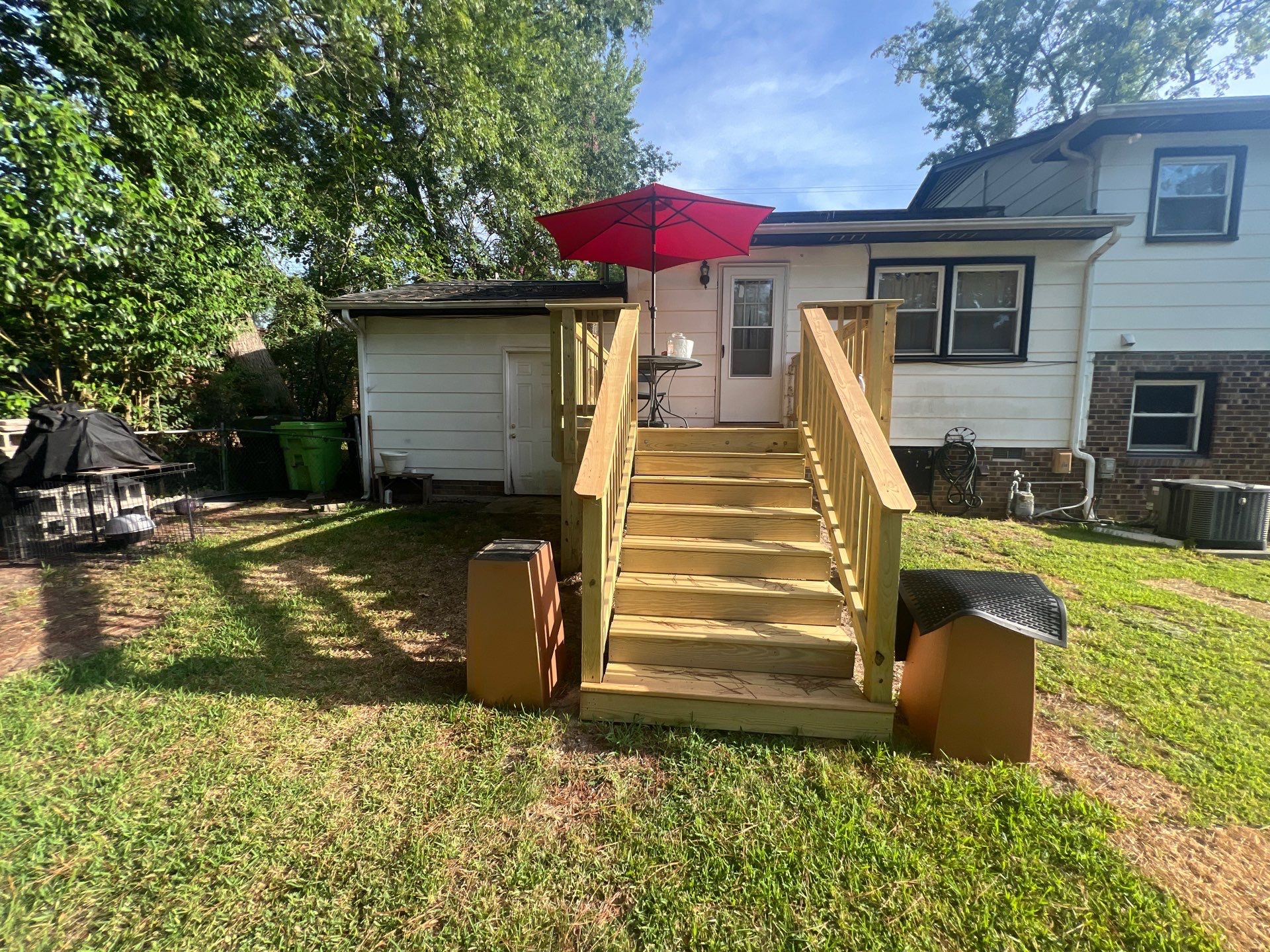 Custom Pressure-Treated Wood Deck and Staircase Construction in Raleigh by The Remodeling Company