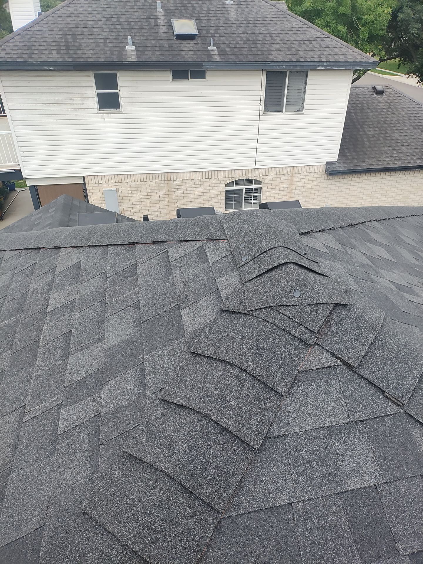 Nothing looks nicer than a little black roof by Bayfront Roofing and Construction