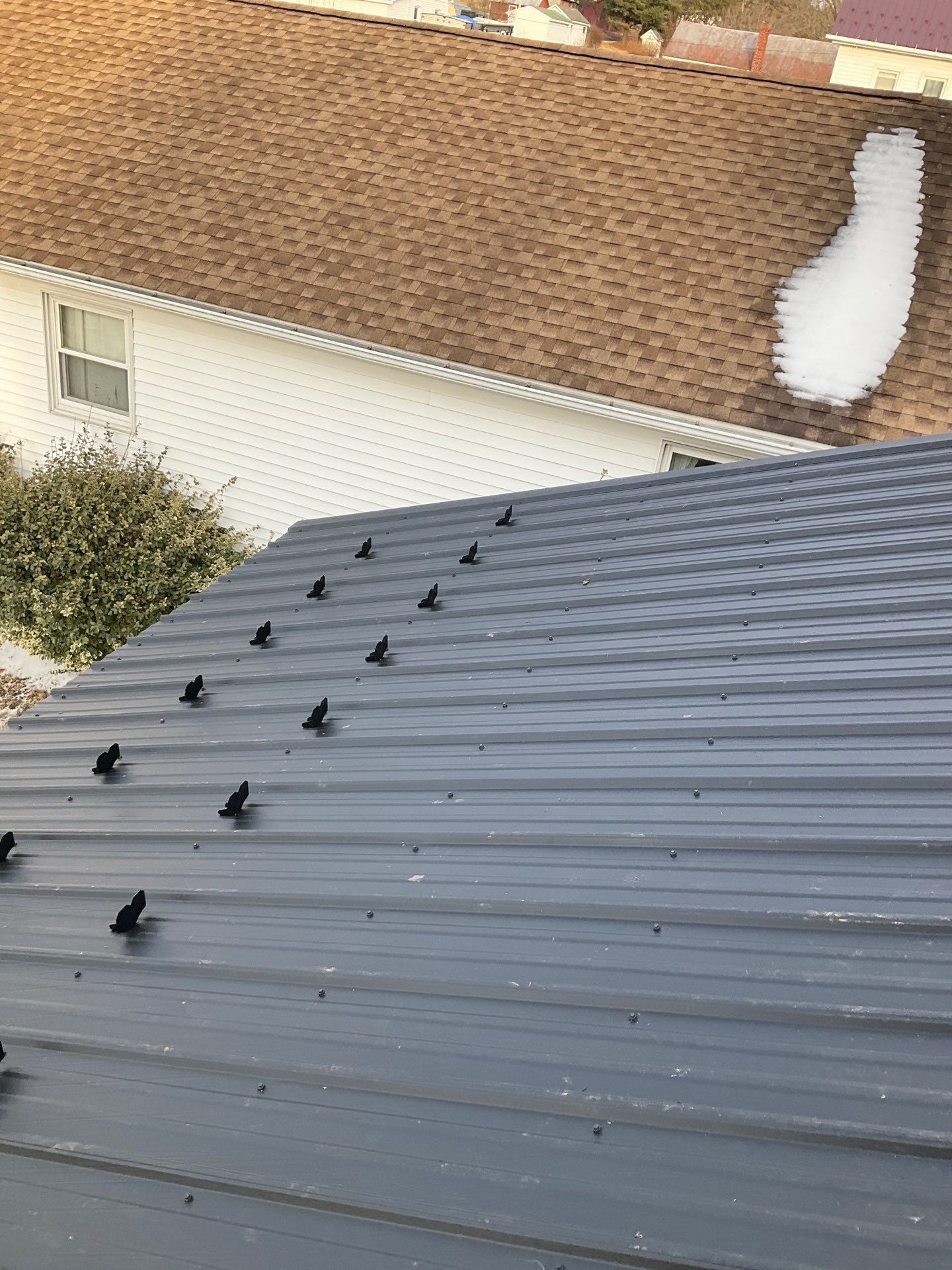 Textured Black Meal Roof by Esh Builders