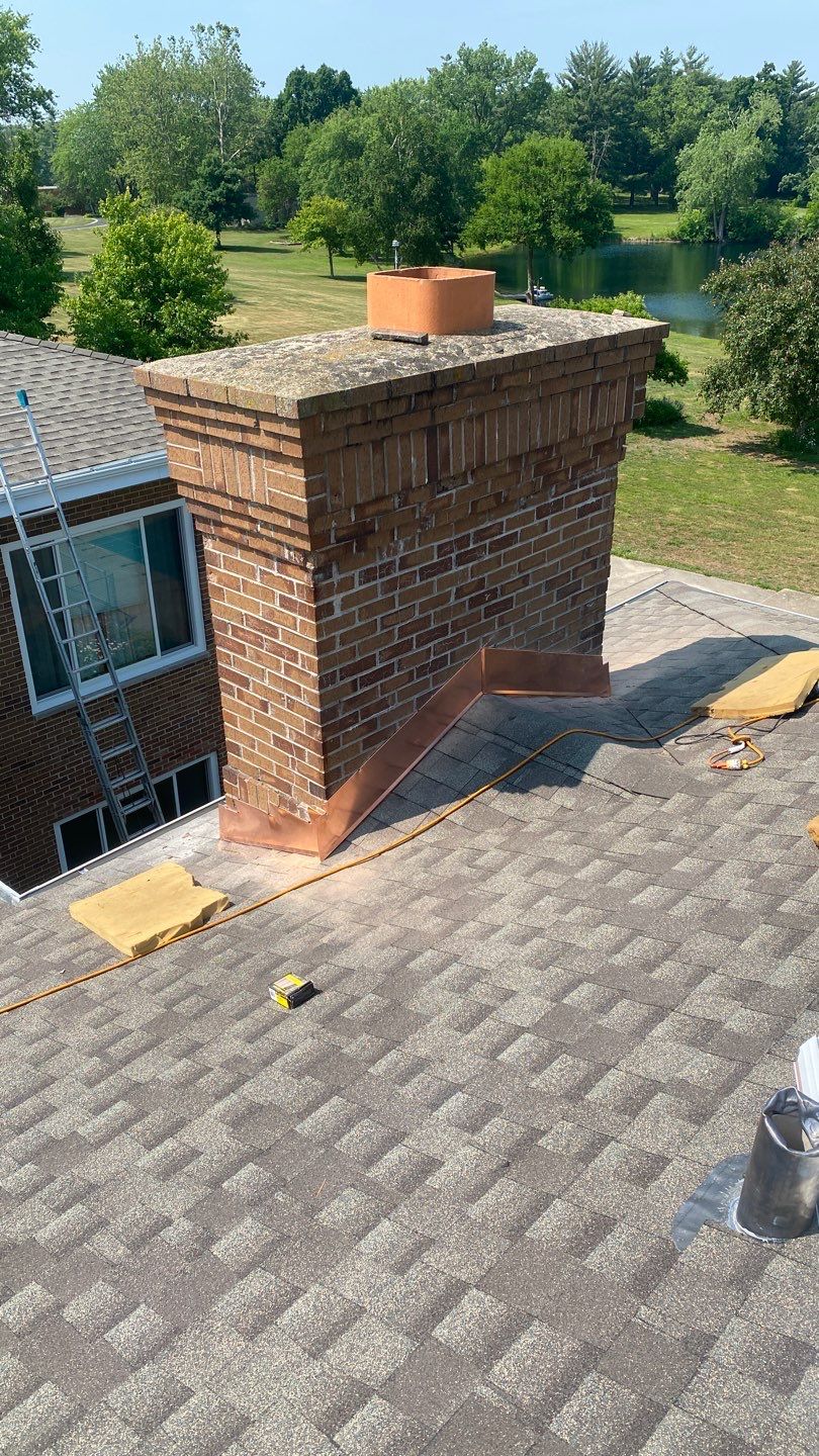 Asphalt Roof Replacement and Aluminum Gutter Installation by Custom Installations