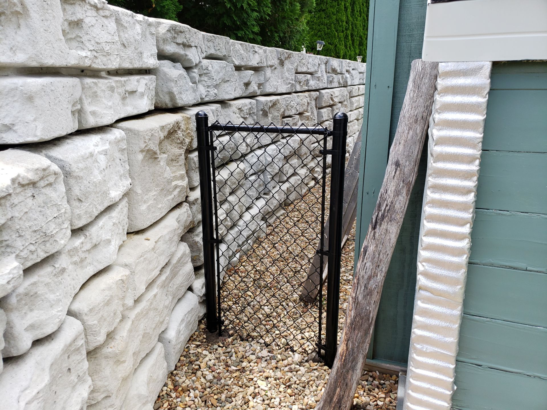 Black Vinyl-Coated Chain Link Fence Installation in Denver by Perfect Picket Fence and Stain