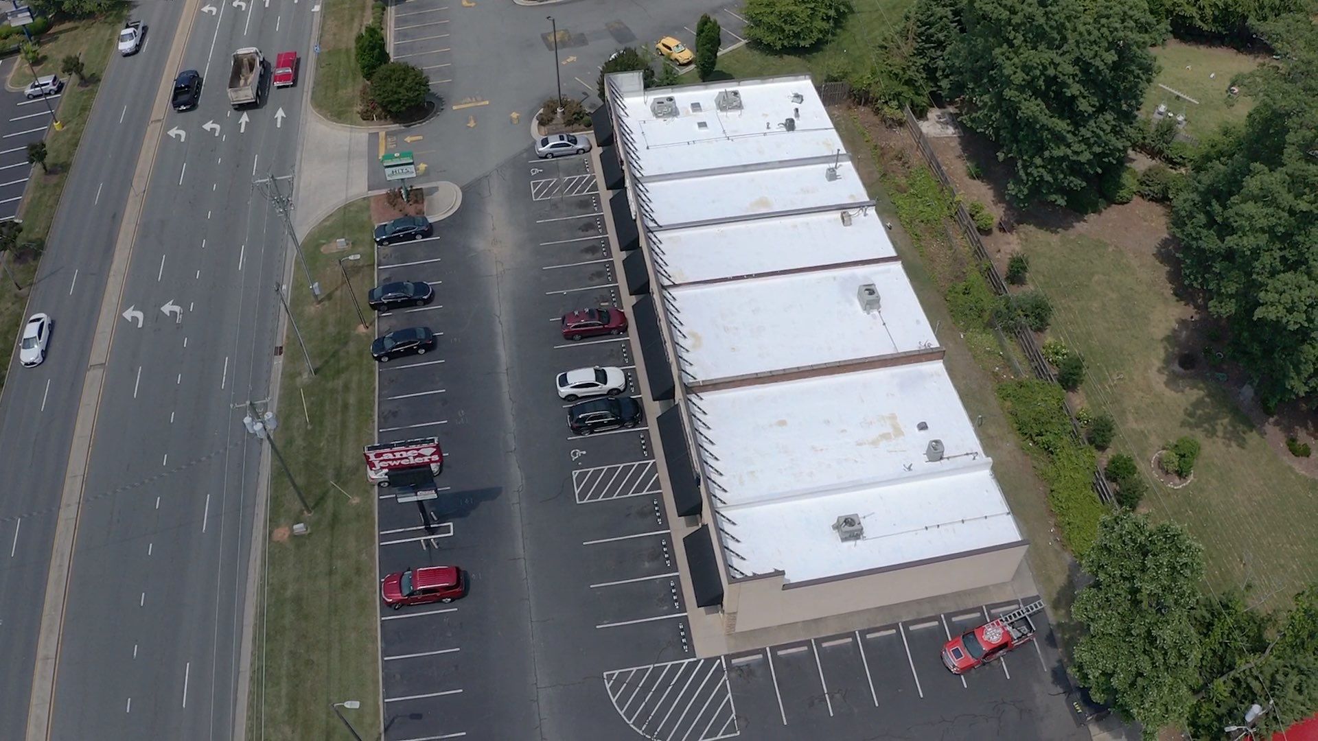 Commercial Roof Coating using Fiberseal basecoat and Silicon Topcoat by Just In Time Roofing and Restoration