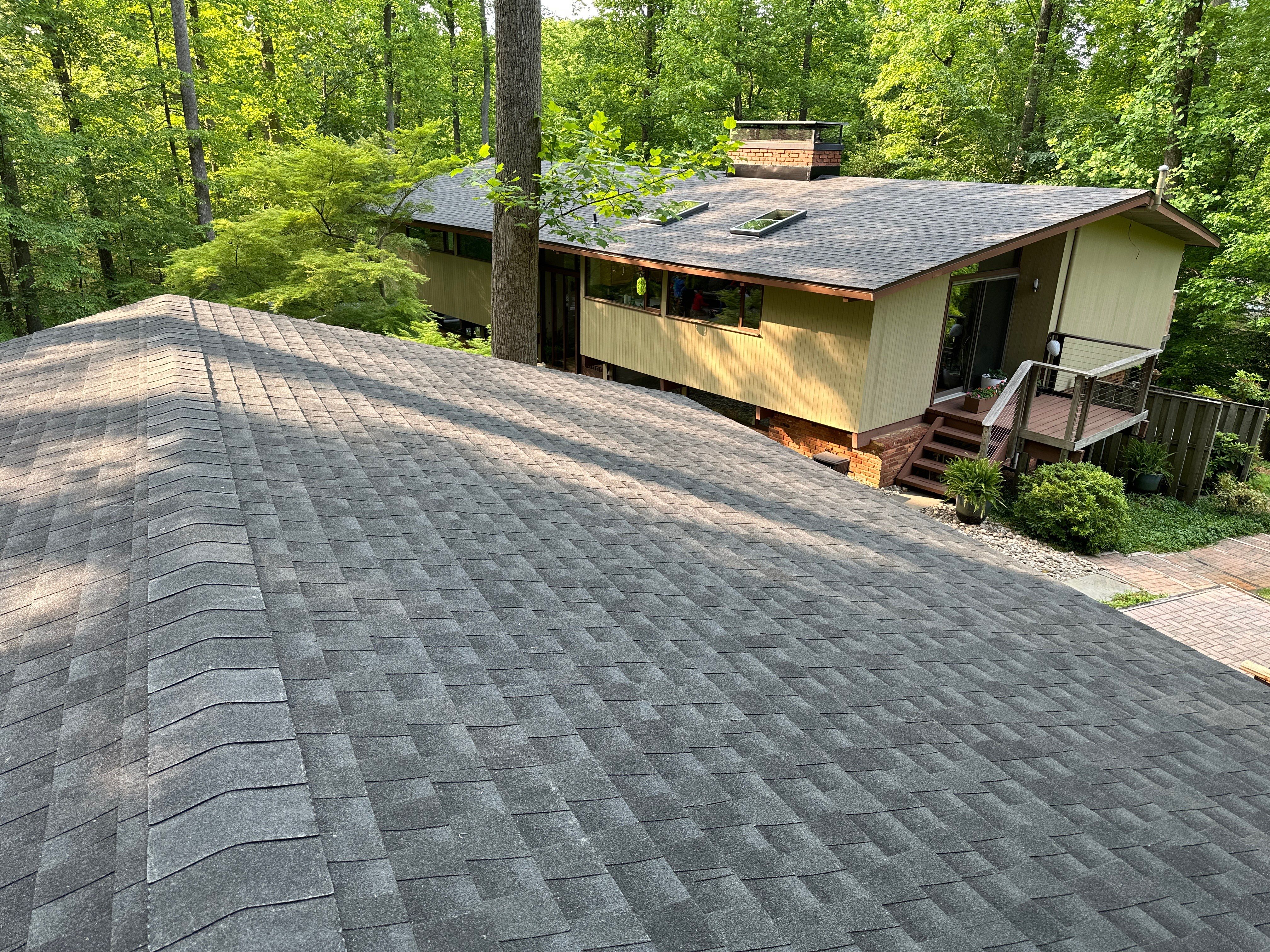 Acorn Deck House Roof Replacement + Skylight Addition by American Home Contractors
