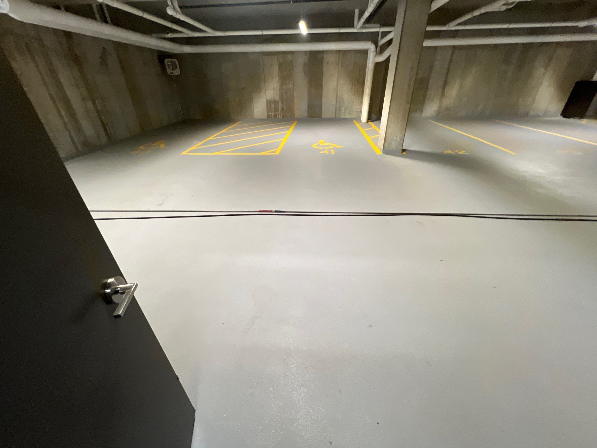 Parking garage using Hot water by Northern Power Washing LLC.