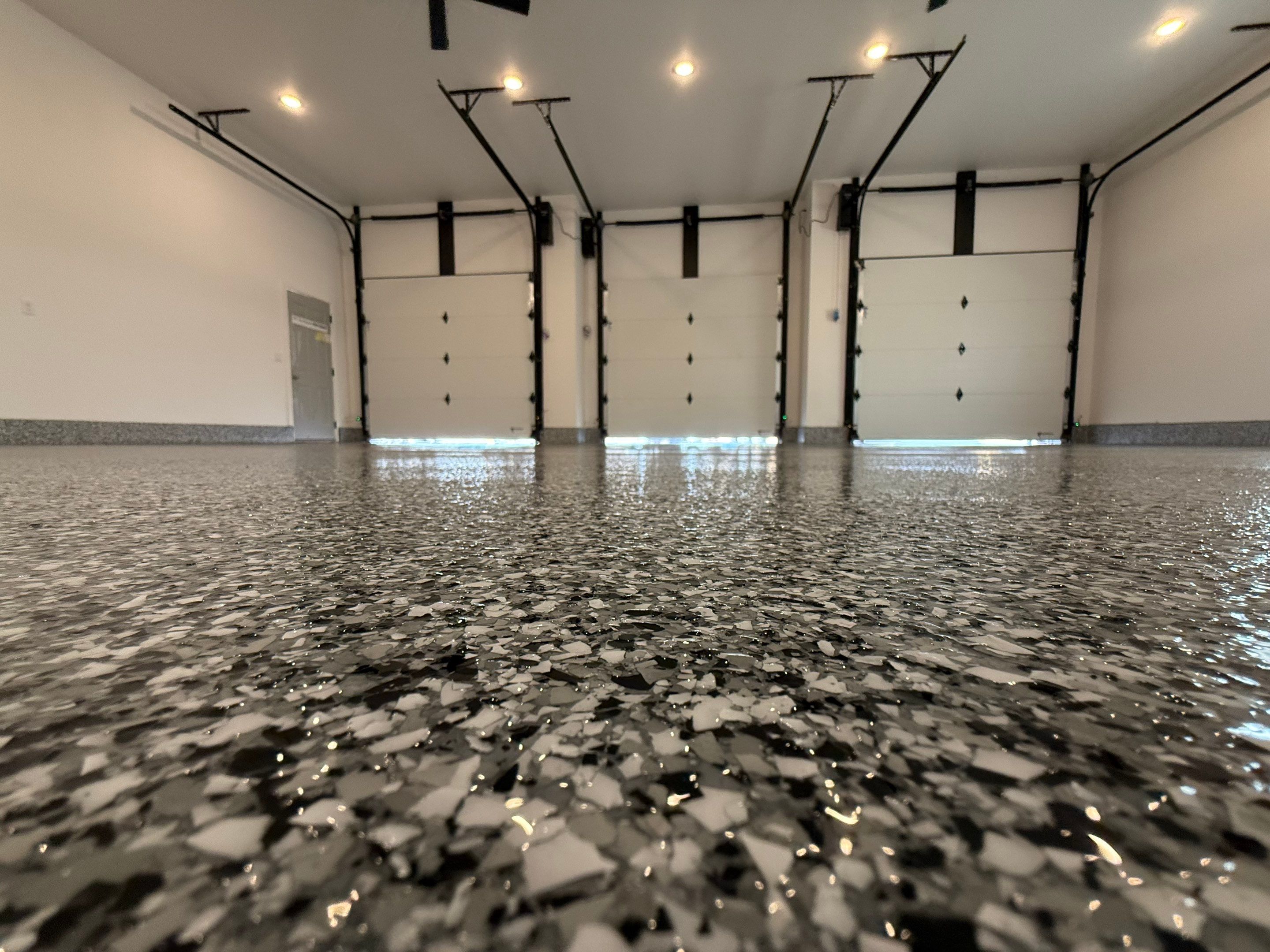 Multi-Car Garage Epoxy Floor Coating and Concrete Finishing in Sioux Falls by Select Painting, Coatings & Garage Cabinets