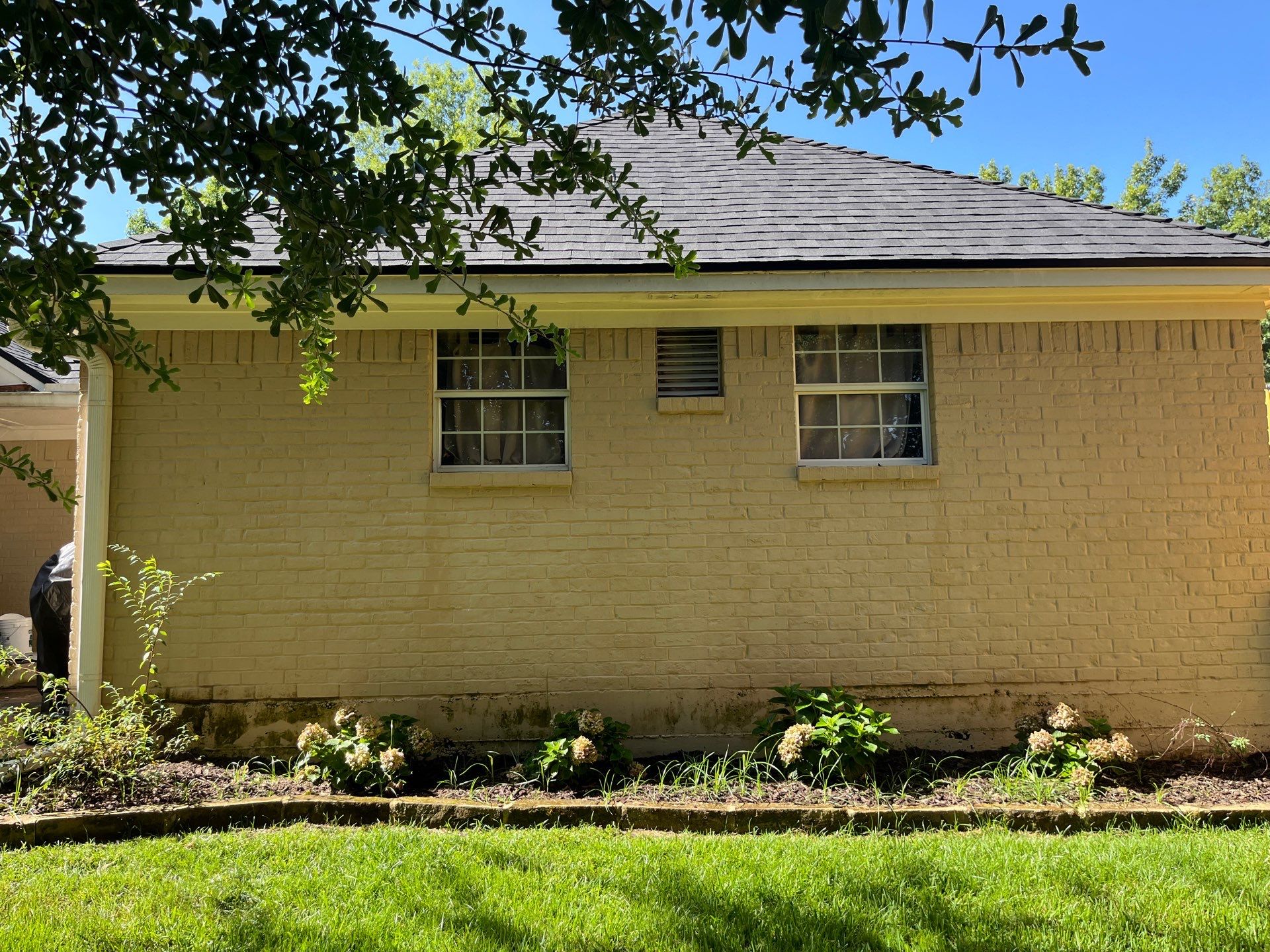 Exterior Painting in Tyler, TX | Brick House with White & Blue Finish by Quality Coats Painting