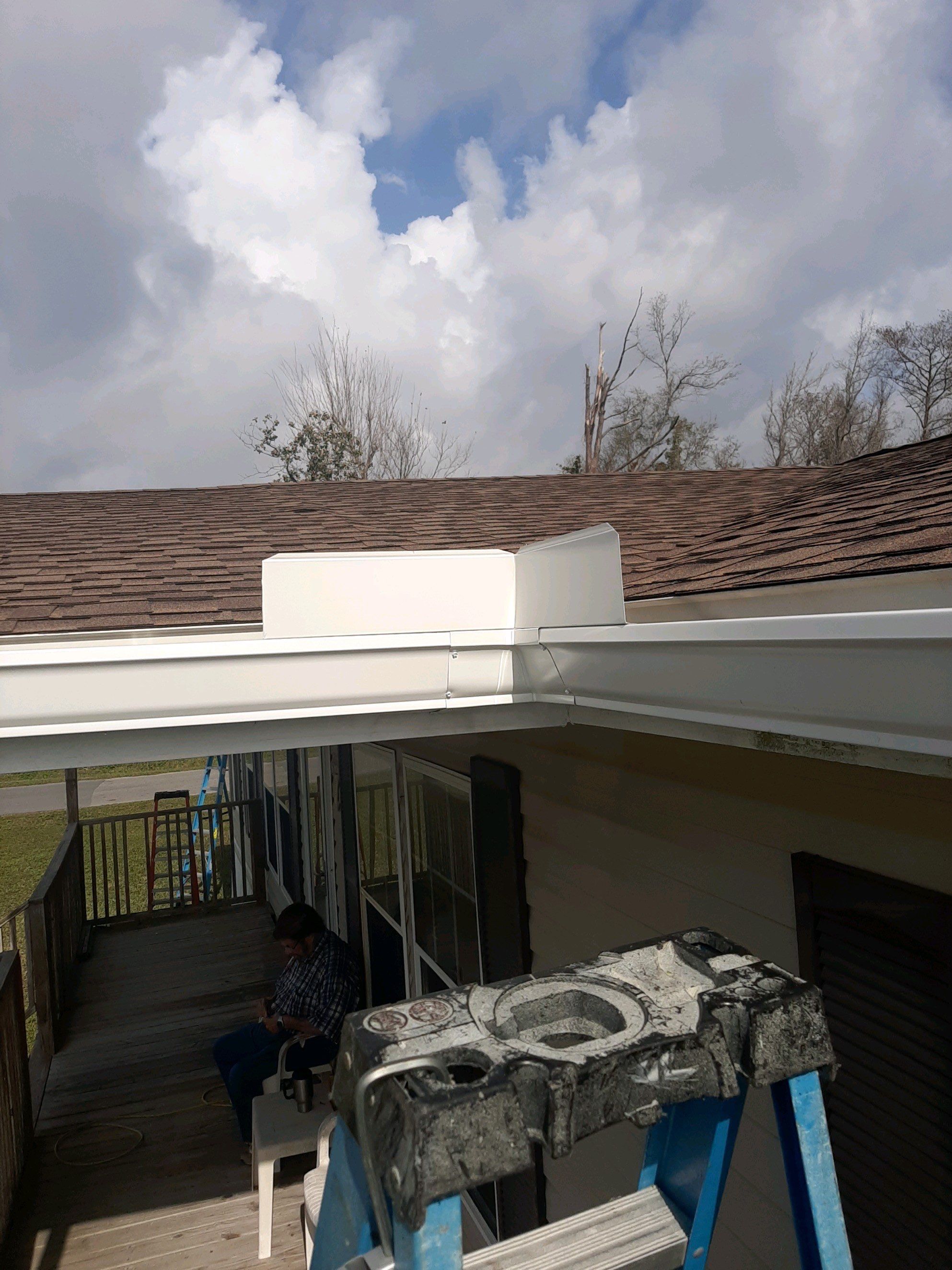 Gutter Installation using White Seamless Gutters by Gutter Professors