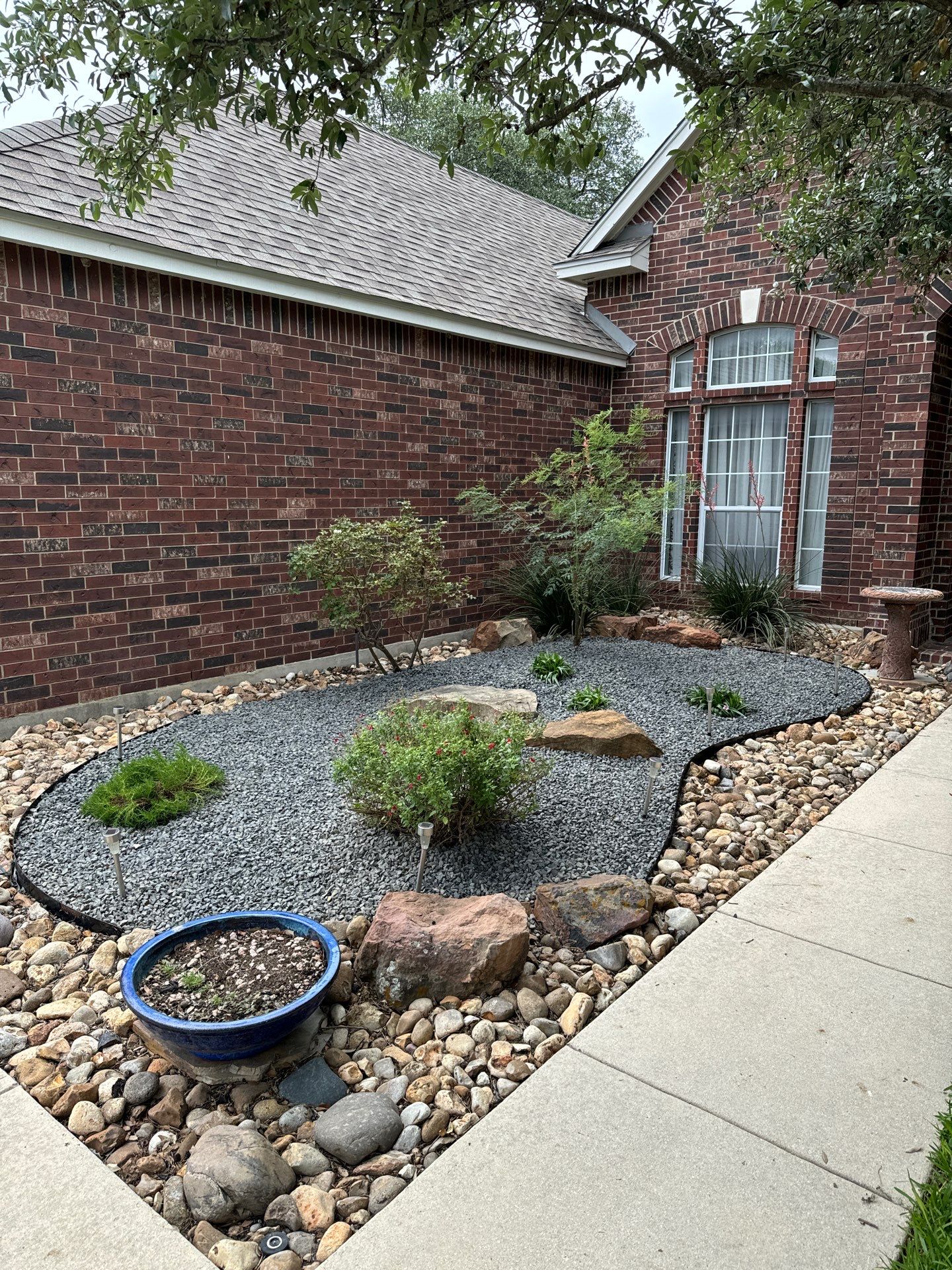 Landscaping Enhancement  using Texas Black Gravel by Hole In One Lawns, LLC