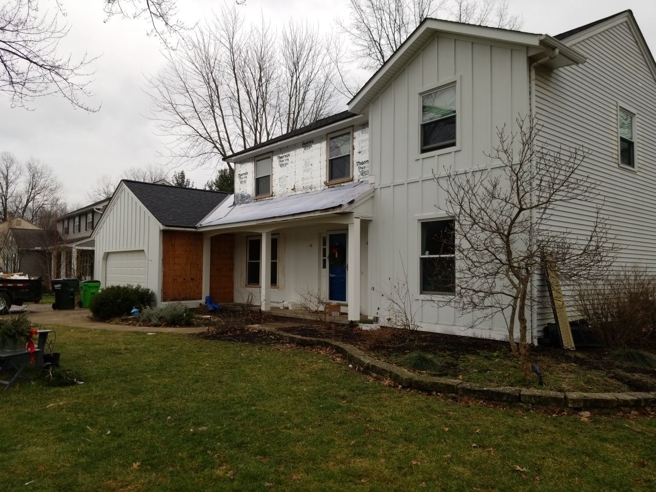 James Hardie Siding  using James Hardie Board and Batten, White by Absolute Roofing and Construction