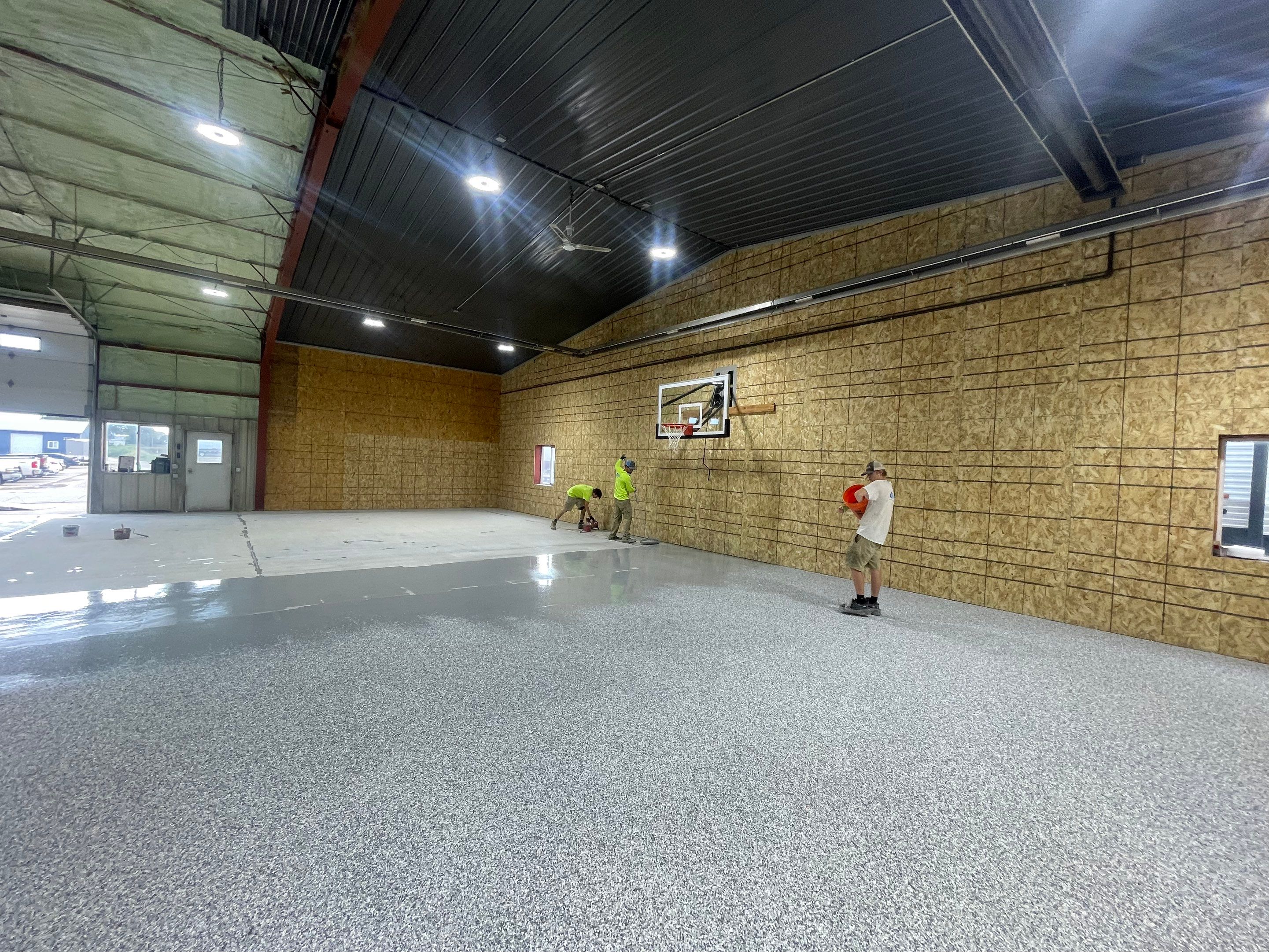 Custom Polyurea Shop Floor with Basketball Court Lines in Rock Valley by Select Painting, Coatings & Garage Cabinets