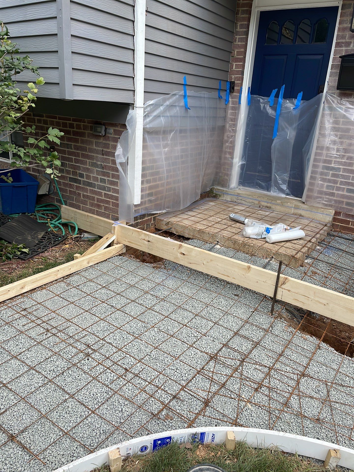 New walkway with stairs and a new front porch by Fairfax Contractors, LLC