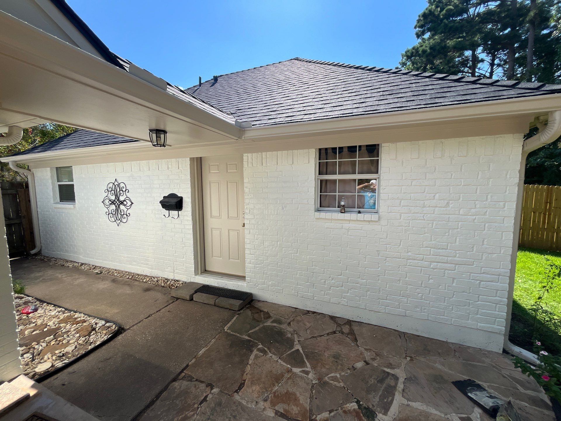 Exterior Painting in Tyler, TX | Brick House with White & Blue Finish by Quality Coats Painting