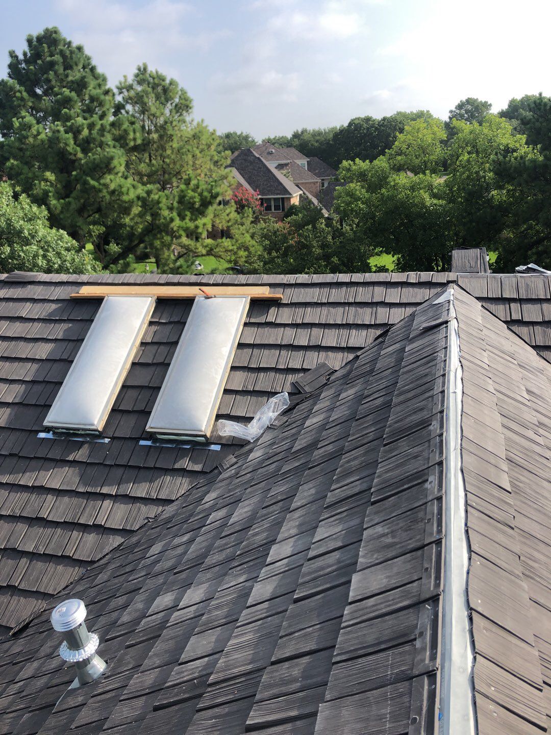 Designer Residential Roof with Zip System by Springtree Restoration