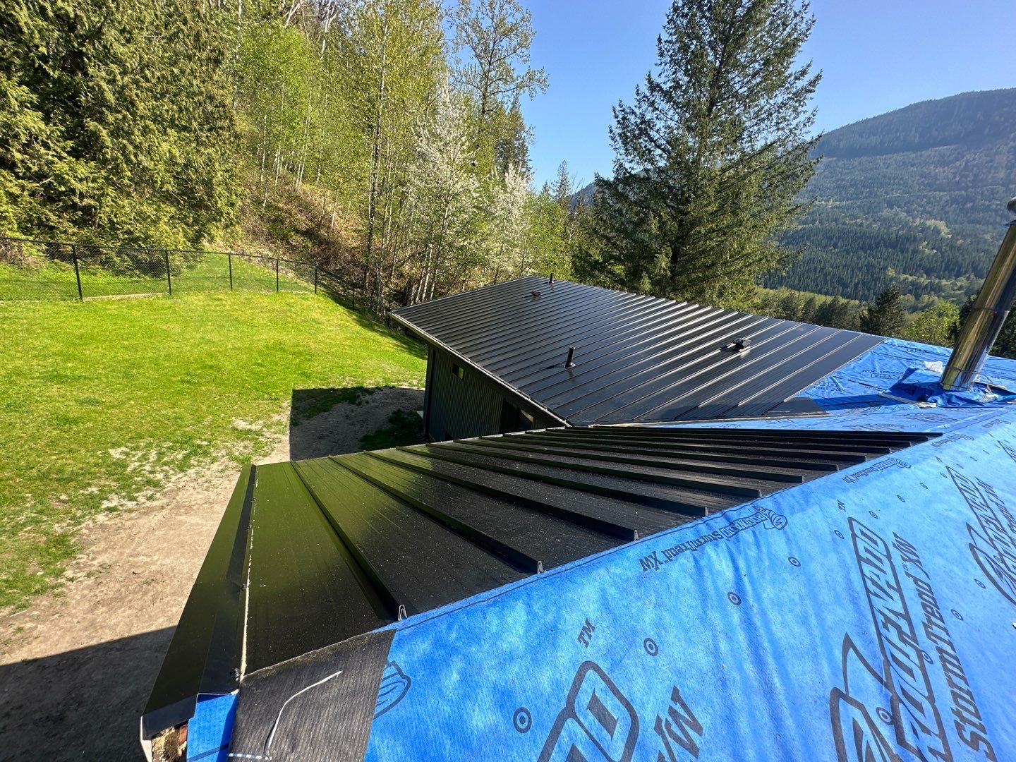 Residential ReRoofing Installation using 12" Prolok metal by Top Notch Roofing Inc