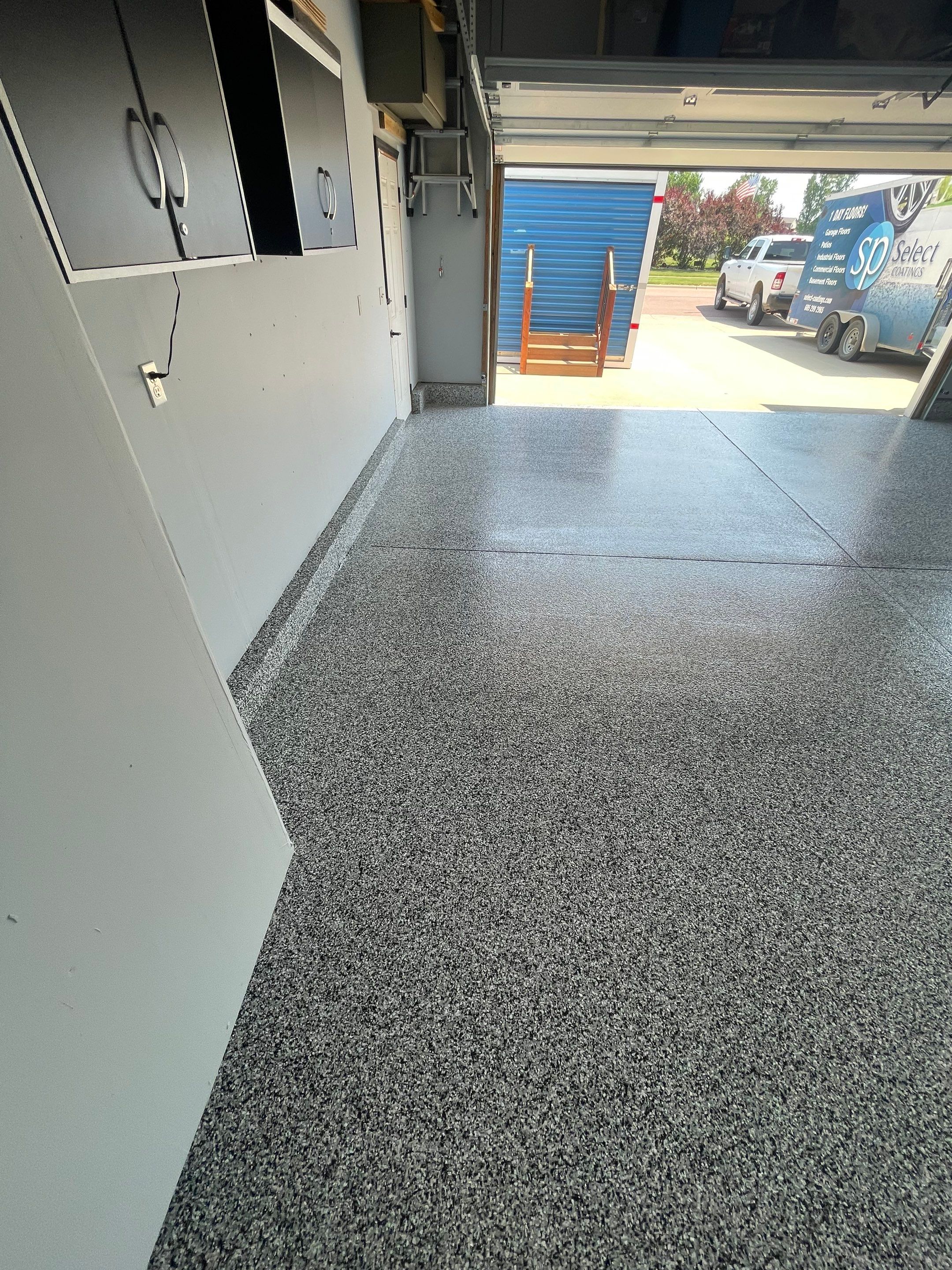 Sioux Falls Garage Concrete Coating Installation with Domino Flake by Select Painting, Coatings & Garage Cabinets