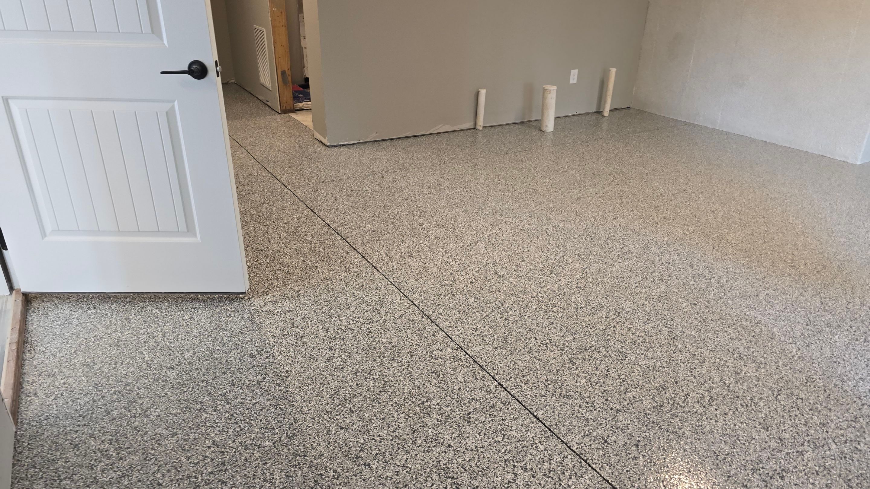 Patio Using Basalt & Garage Using Gravel by Elite Floor Solutions