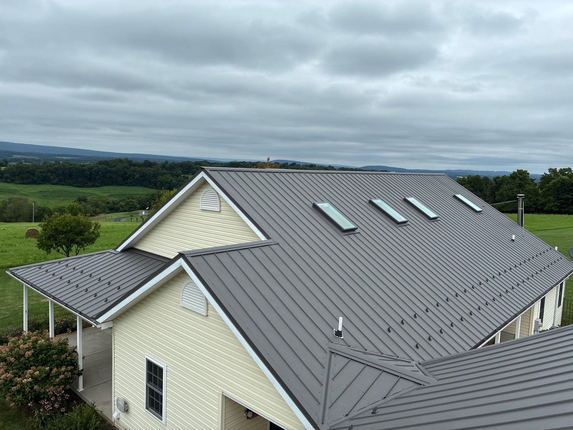 Newport Metal Roof Replacement with New Skylights by Esh Builders