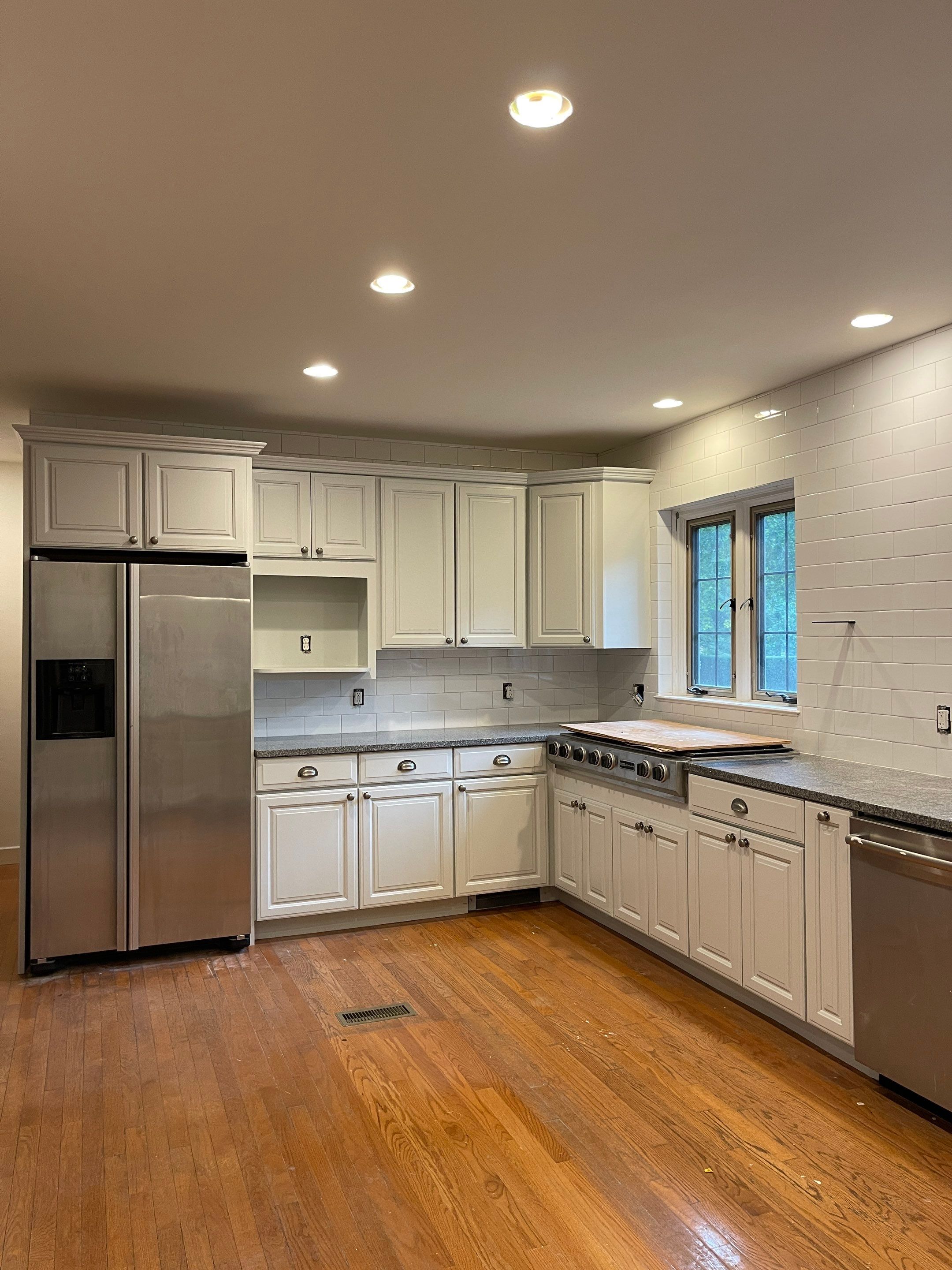 Kitchen Cabinet Painting using Milesi 2k by Trendy Walls Inc.