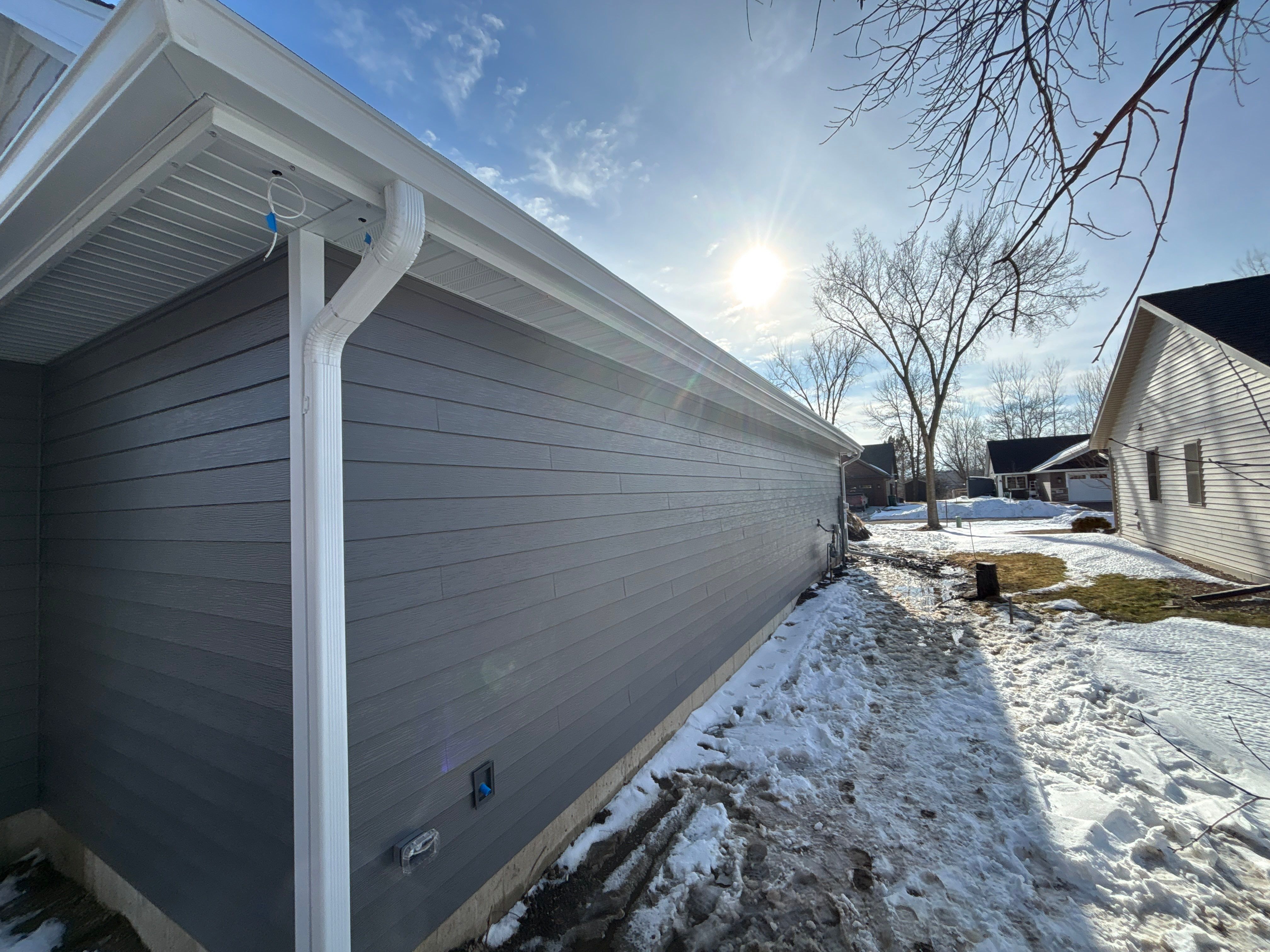 White Seamless Gutter and Gutter Guard Installation in Annandale by Next Level Seamless Gutters / Exteriors Inc.