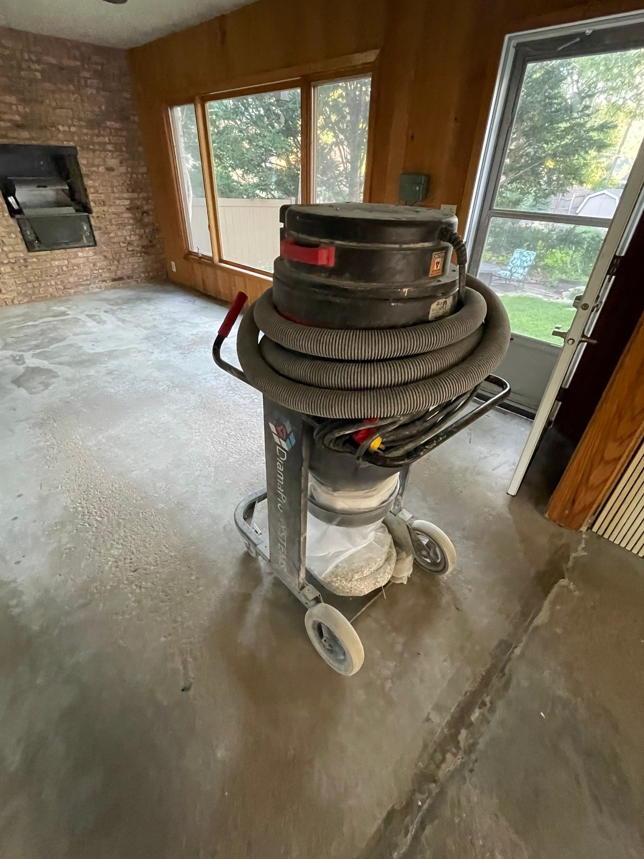 Sioux Falls Garage and Sunroom Concrete Coating with Coyote Flake by Select Painting, Coatings & Garage Cabinets