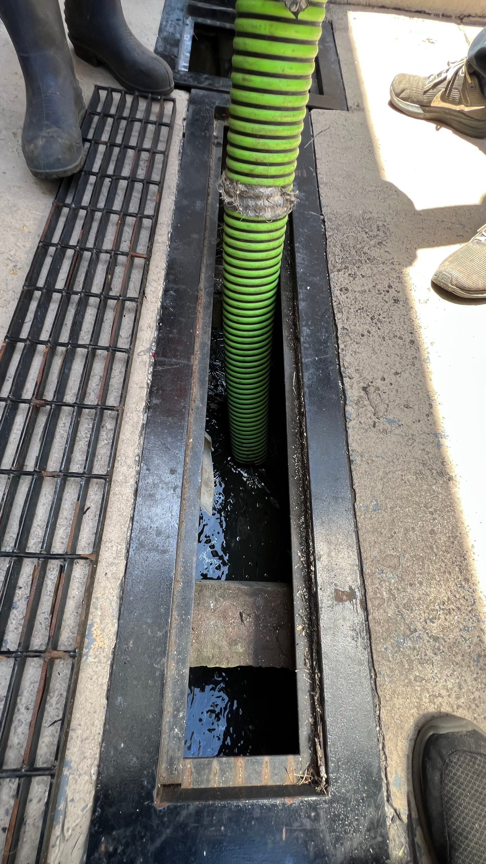 Condo Channel Drain and Sump Pit Cleaning by APS Power & Water