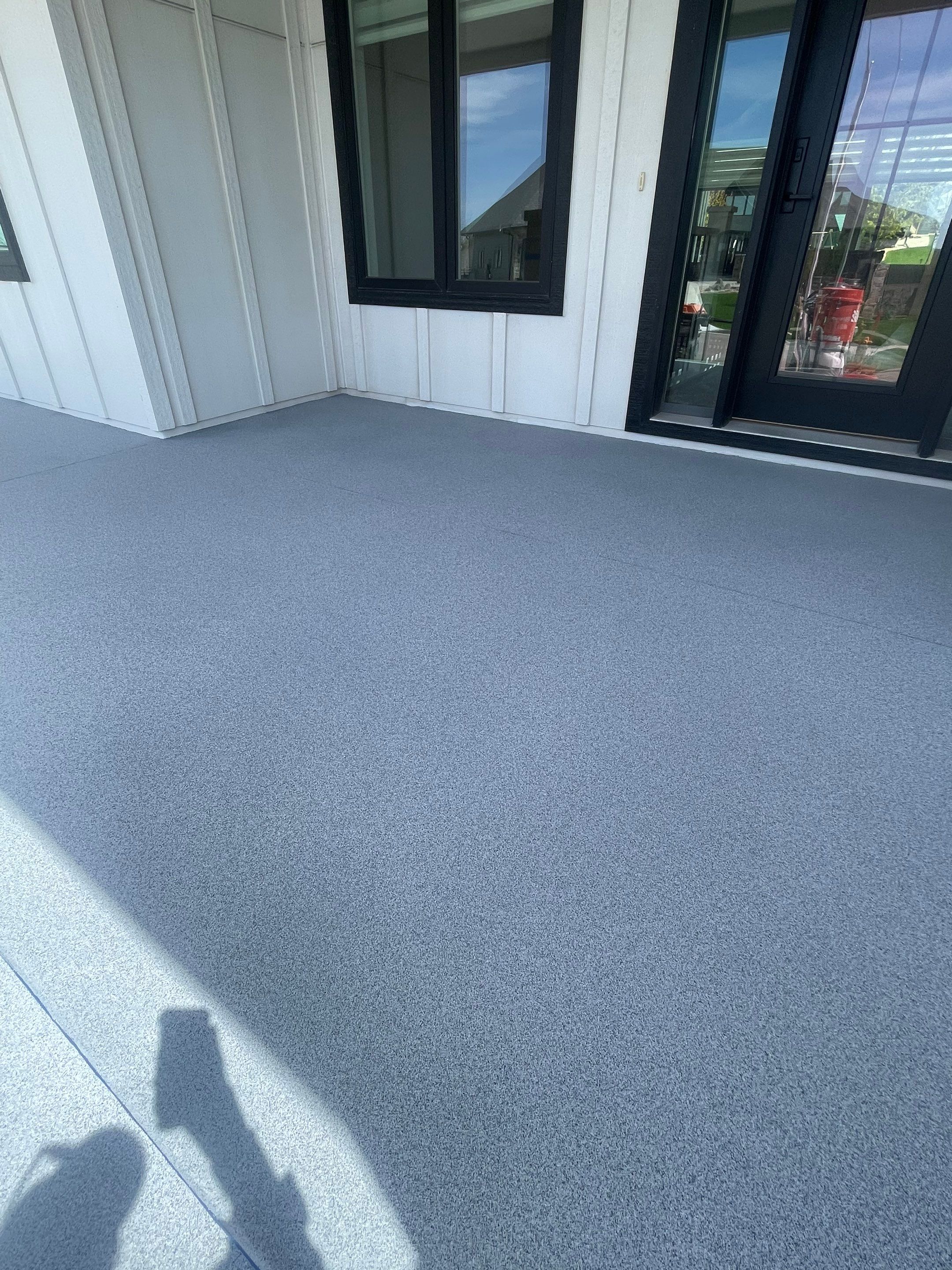 Grey Speckled Concrete Porch Coating for Sioux Falls Home by Select Painting, Coatings & Garage Cabinets