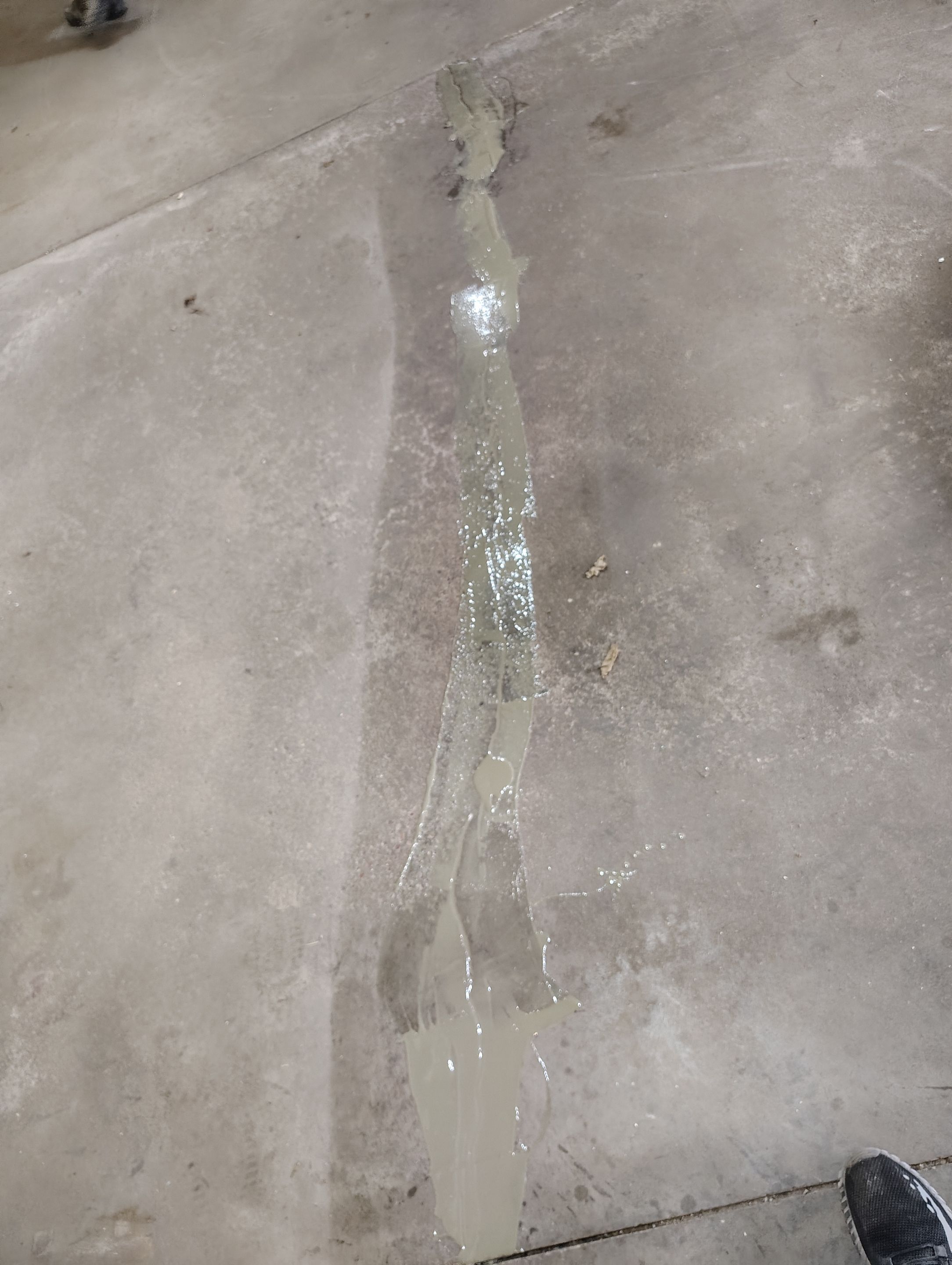 Sioux Falls Garage Floor Repair and Speckled Epoxy Coating Installation by Select Painting, Coatings & Garage Cabinets