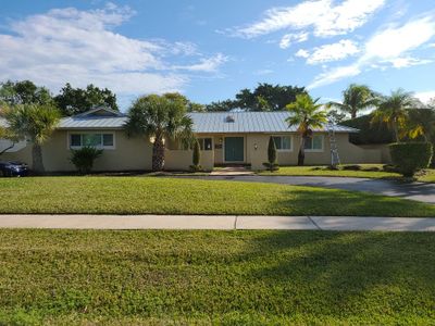 Residential Roofing Installation using 1" Nail strip metal roof