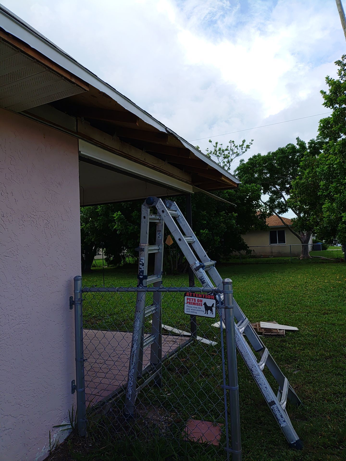 Replace gutter using White Down Spouts in Cape Coral FL by Gutter Professors