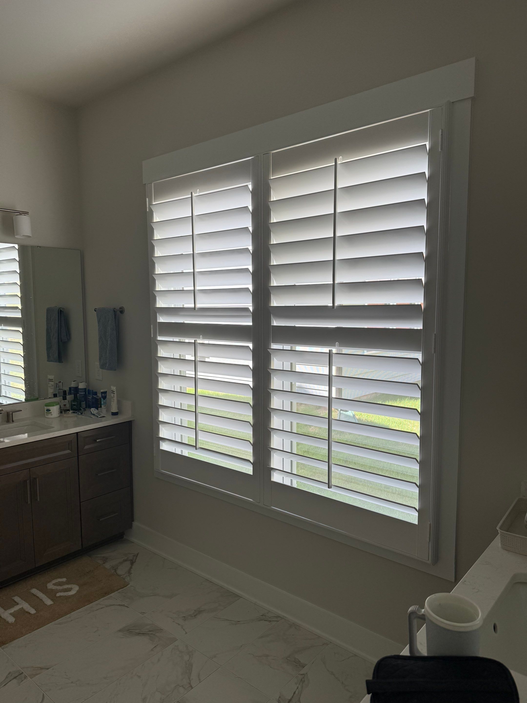Whole Home Interior Shutter and Roller Shade Installation in Charlotte by Southern Traditions Window Fashions