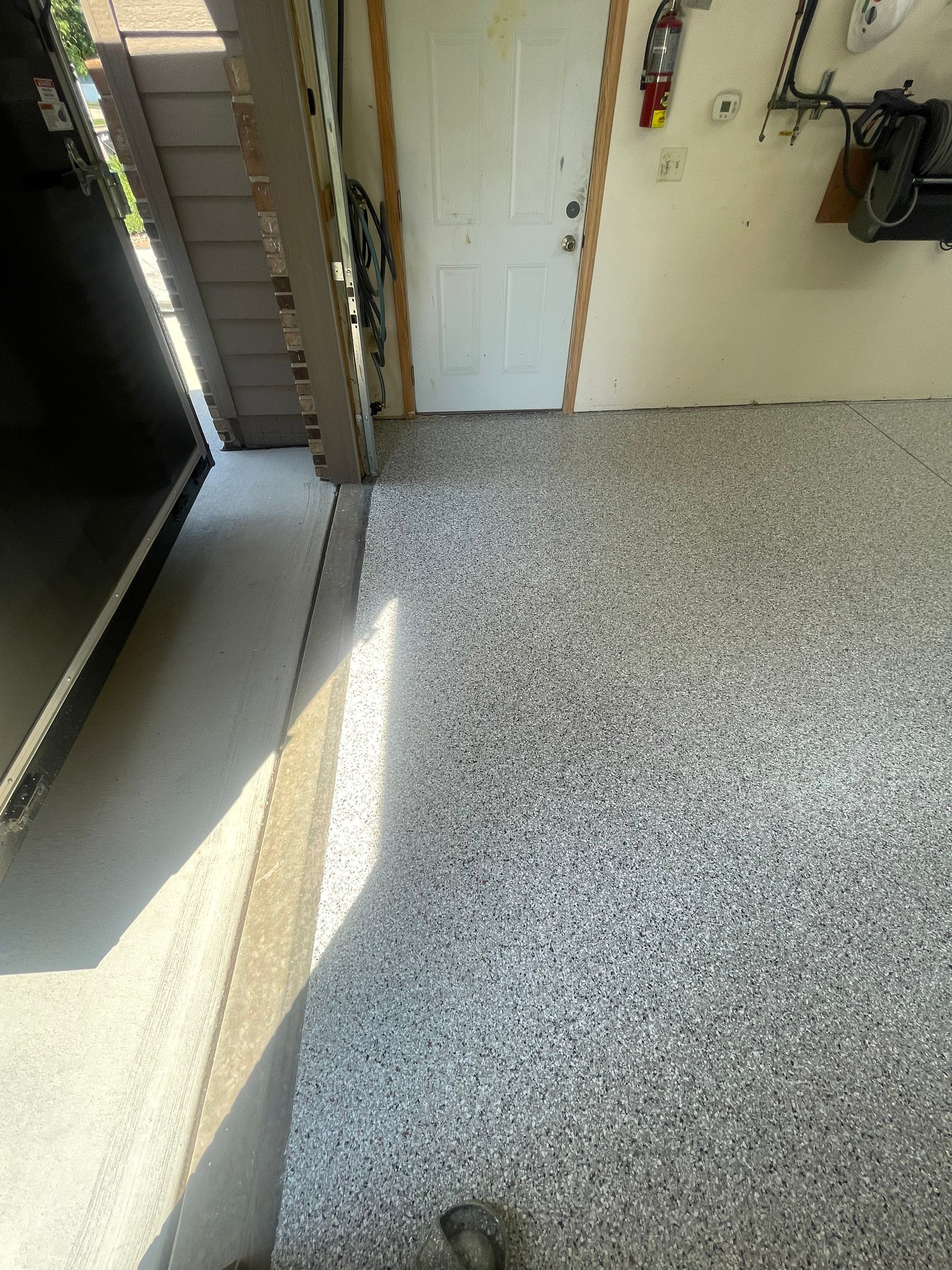 Multi-Stall Garage Floor Coating Installation in Sioux Falls by Select Painting, Coatings & Garage Cabinets