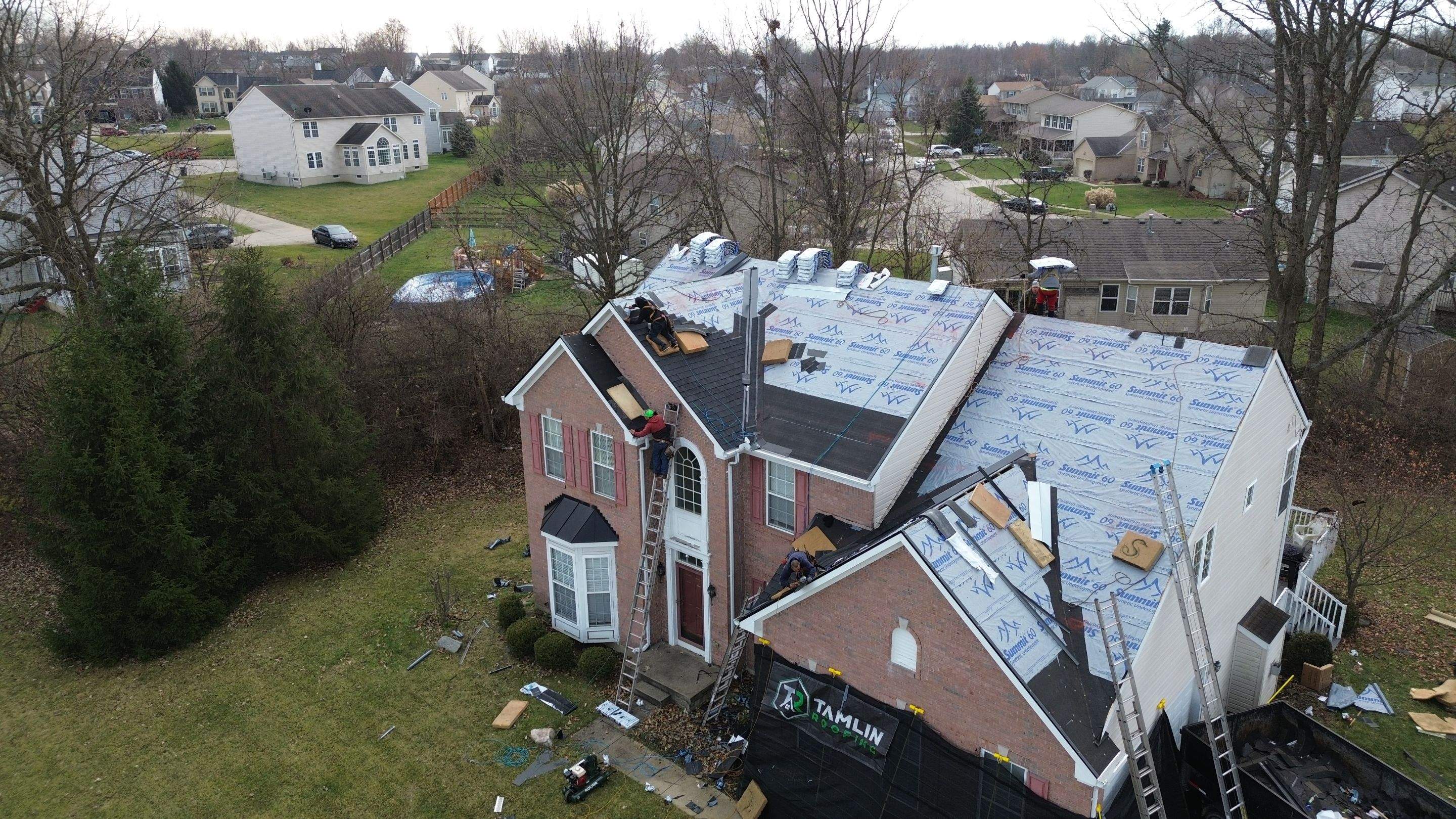 Walden Ponds - Pristine Black and Hydro Flo Gutter Guards by Tamlin Roofing