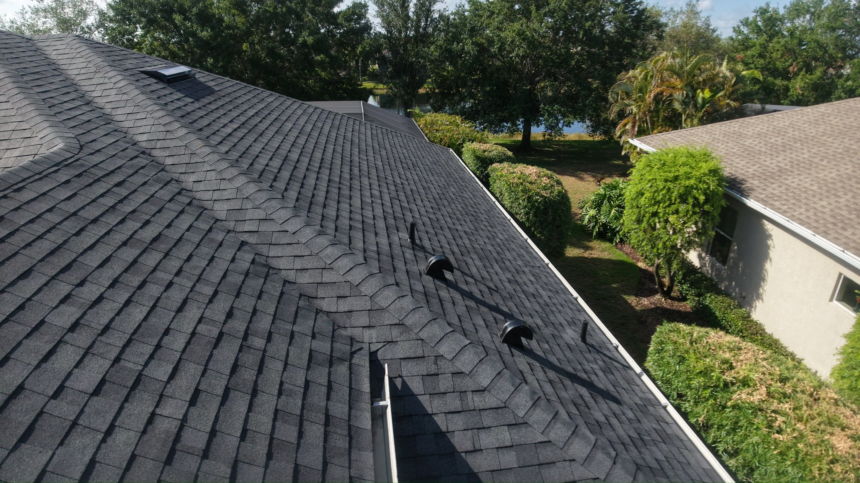 Residential Roof Installation With Estate Grey Architectural Shingles in Bradenton by Trinity Restoration and Roofing LLC