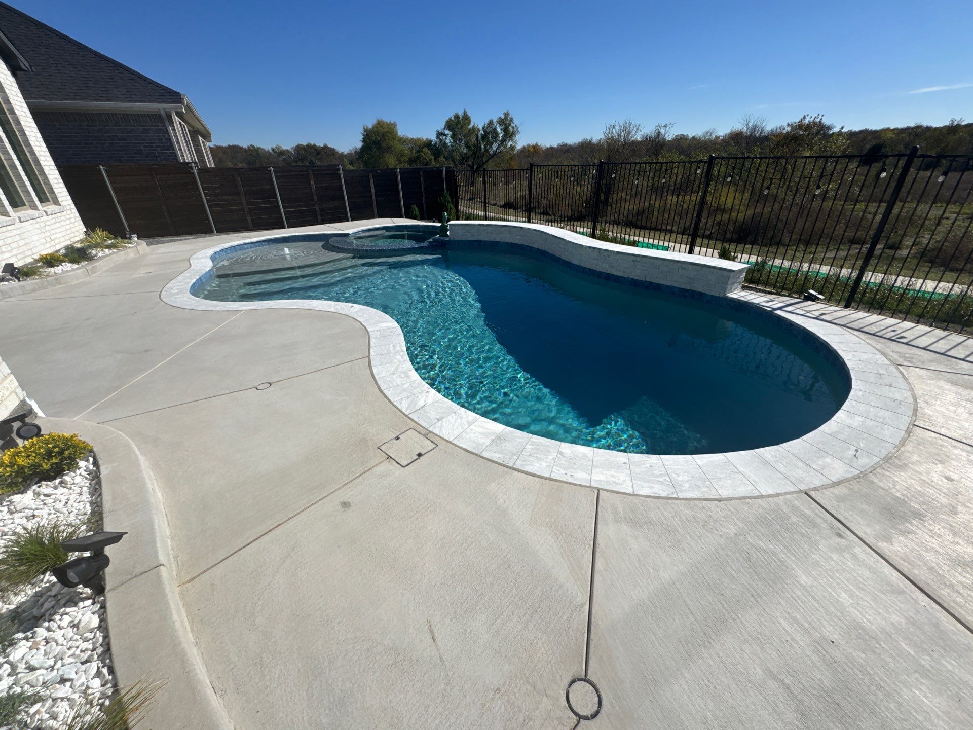 Freeform Pool with Raised Spa and Tanning Ledge by Pinnacle Pools and Spas - DFW