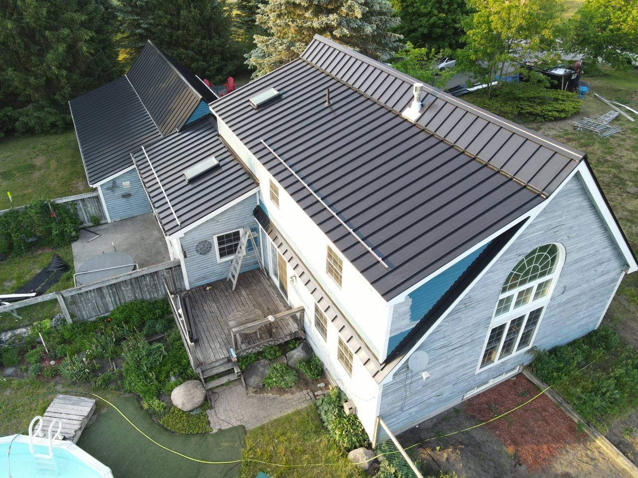 Residential Roofing Installation using 24 Ga Standing Seam Metal  by Jay Carter Roofing & Sheet Metal