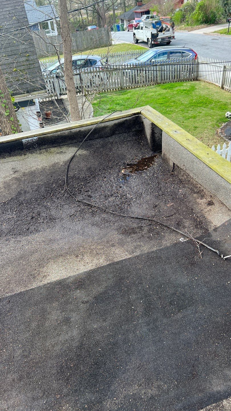 Gutter Cleaning using brown bags by Roof Bullies