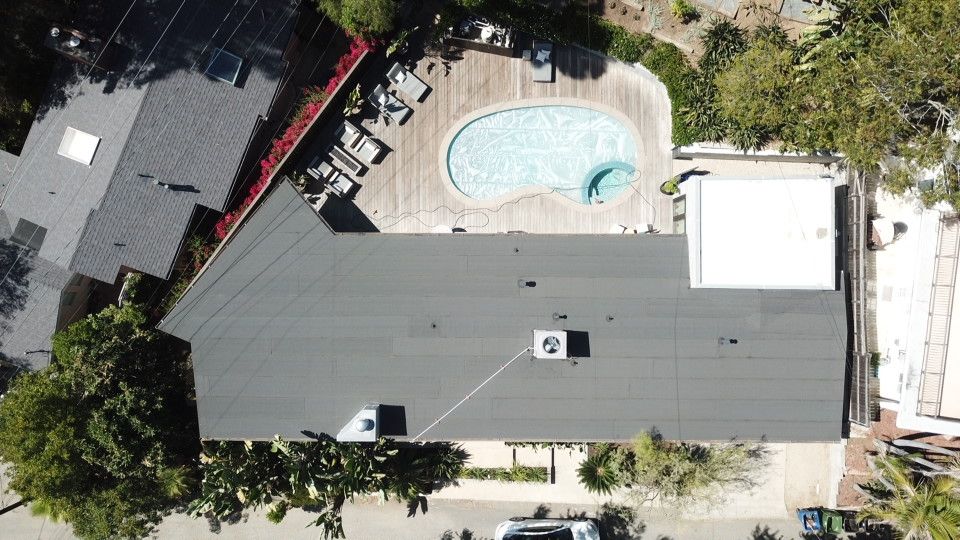 Residential Roofing Installation using Polyfresko® G Highly Reflective Modified Bitumen Cap Sheet by Hull Brothers Roofing