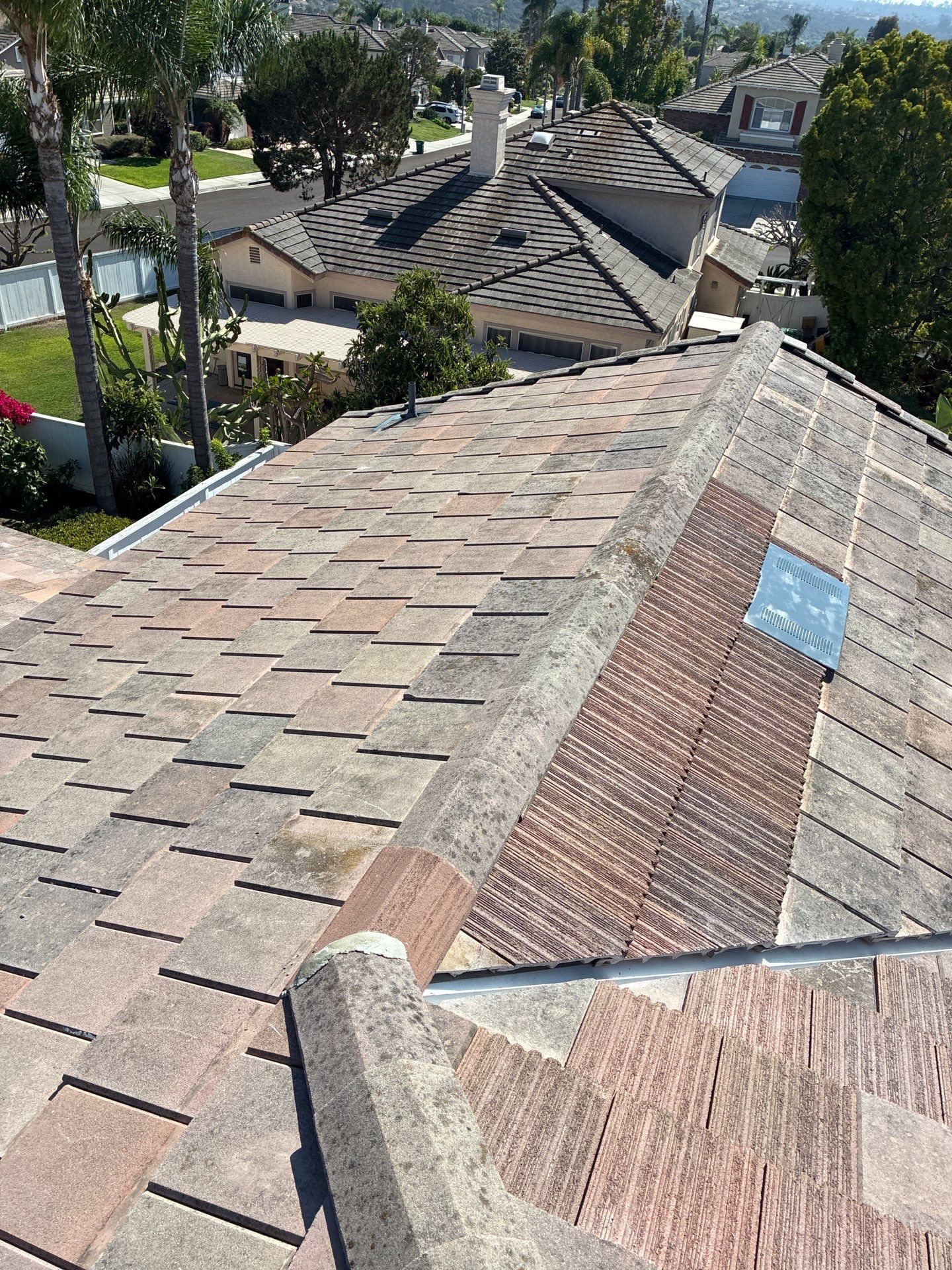 Carlsbad Concrete Tile Roof Replacement with Copper Flashing and Skylights by Reliable Roofing San Diego Inc.