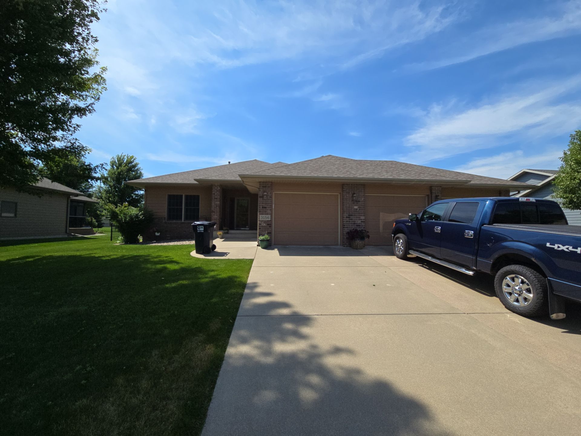 Sioux Falls Residential Exterior Door and Siding Refresh by Select Painting, Coatings & Garage Cabinets