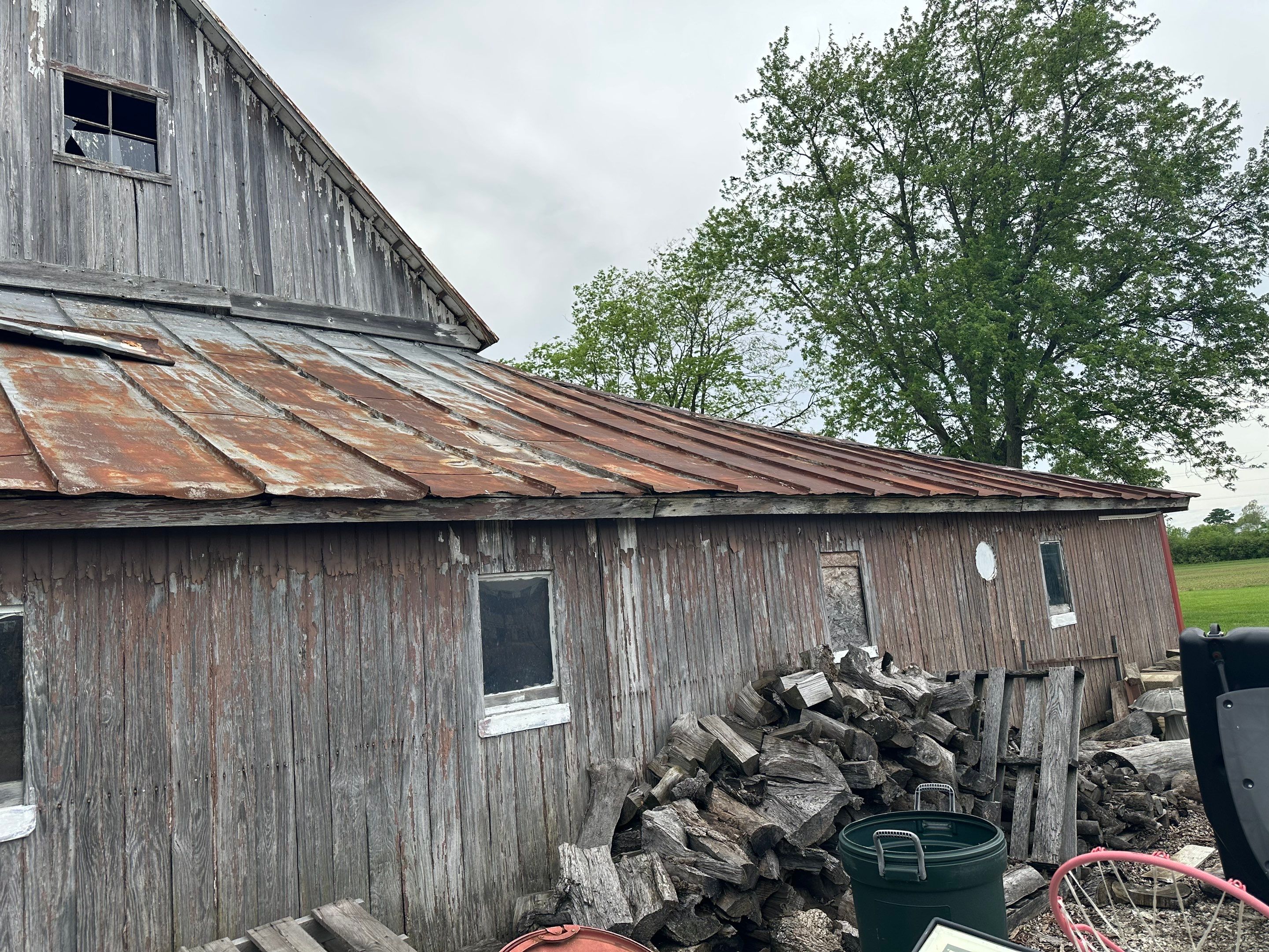 Residential Roofing Installation using Standing Seam Metal - Barn Red by RoofX 