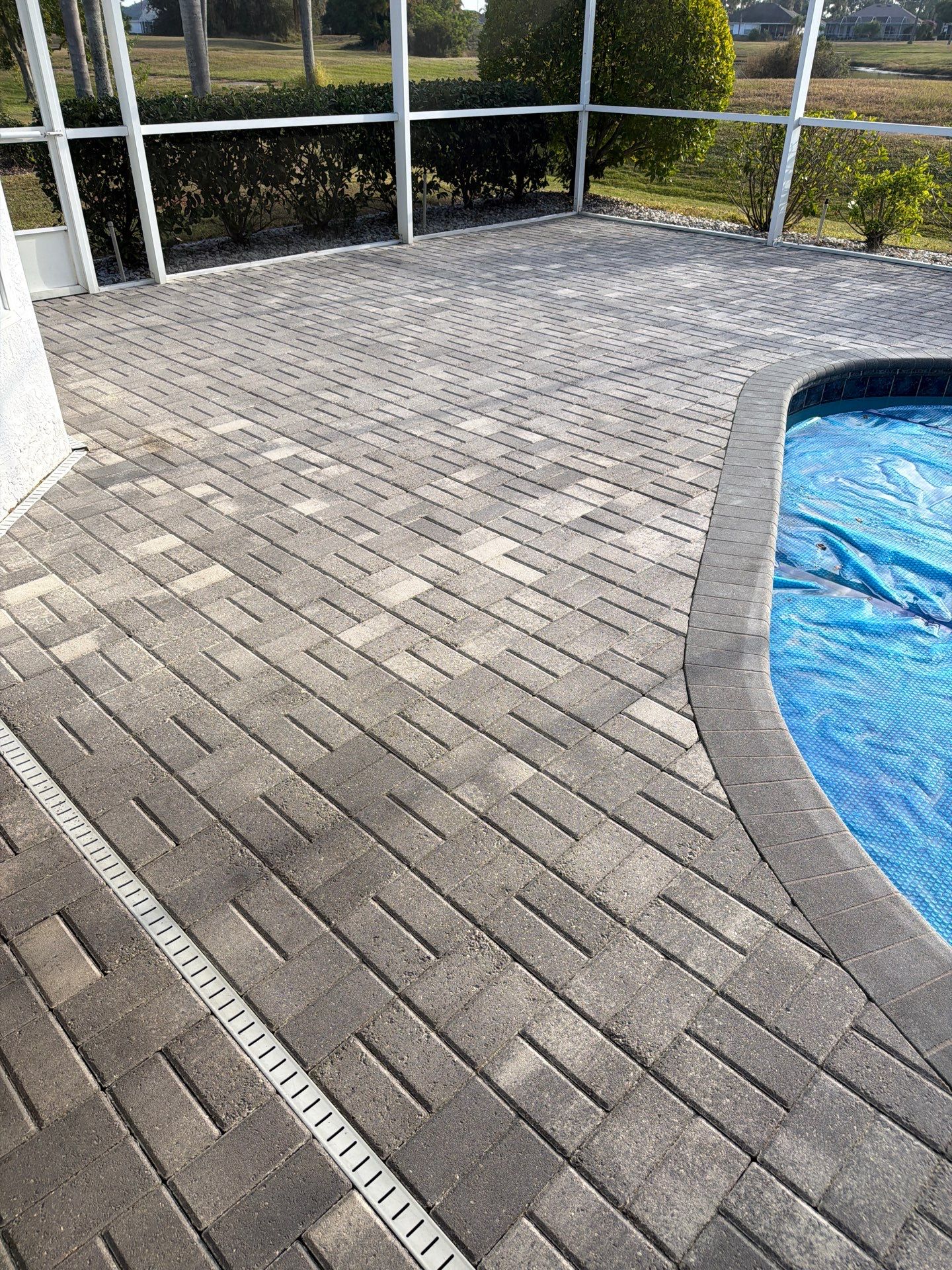 Paver Sealing for Screened Pool Deck in Sun City Center by Supreme Paver Experts