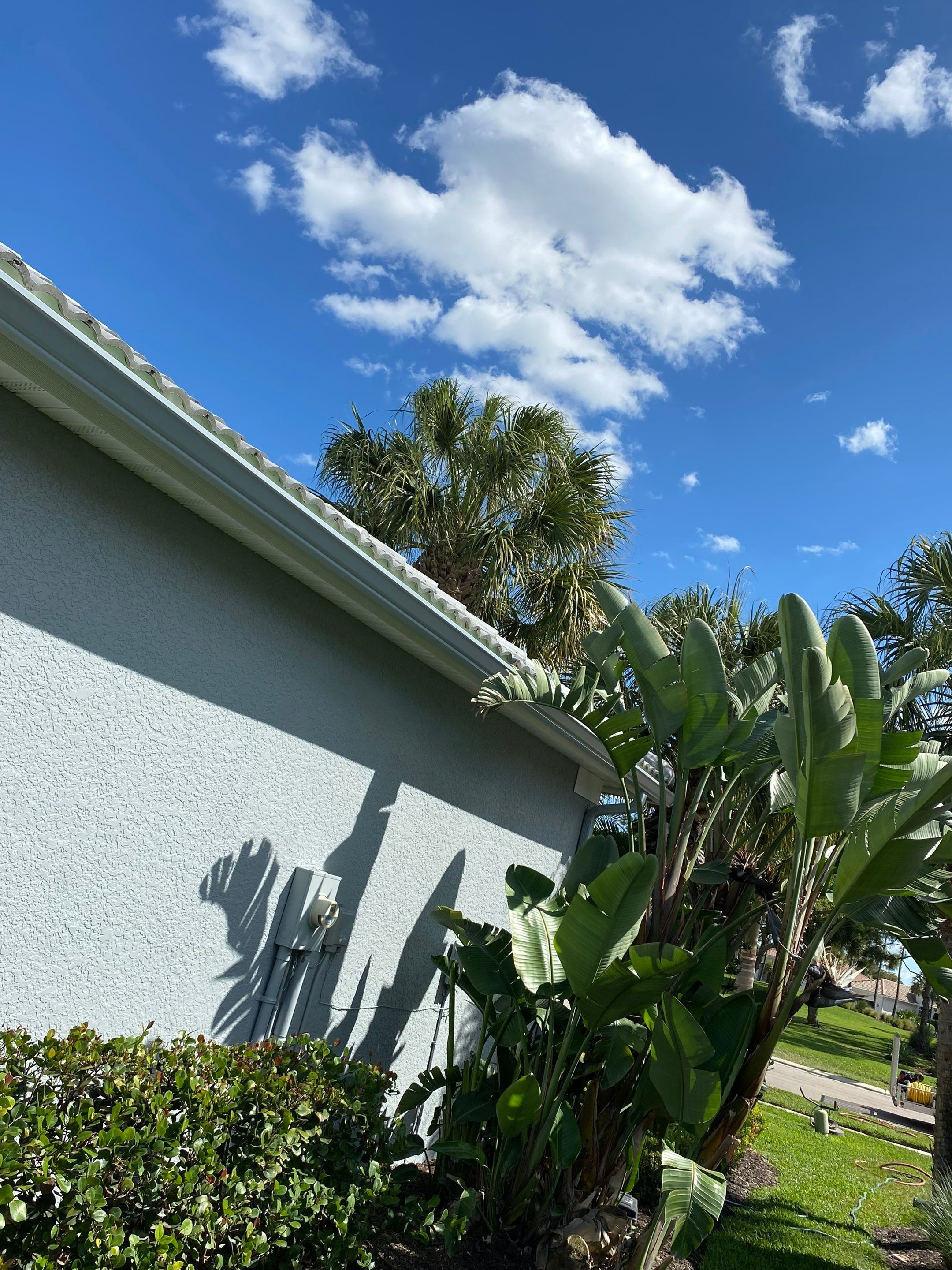6-inch K-style Seamless Gutters and Splash Guard in Grey Color in Naples FL by Gutter Professors