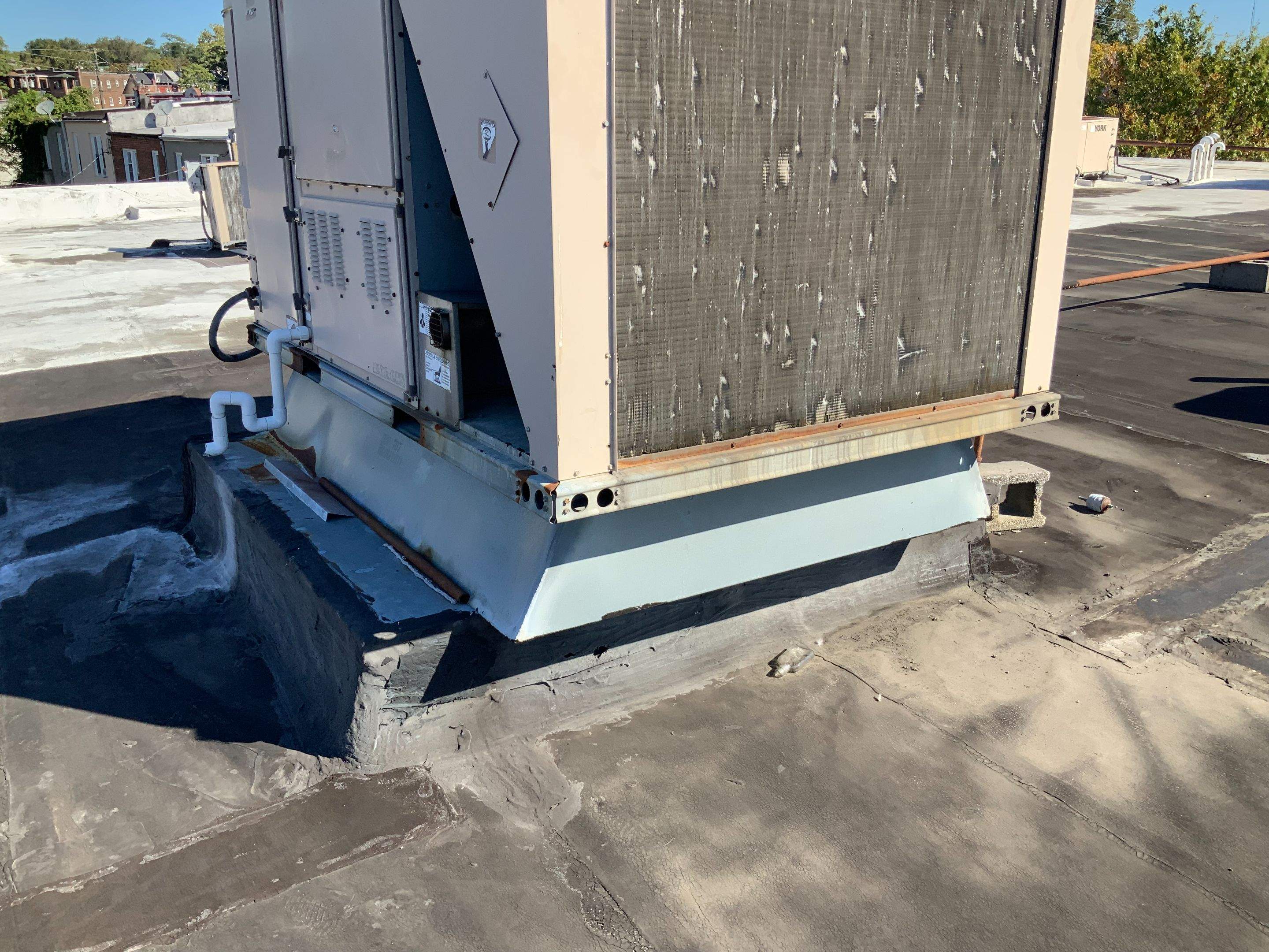 Commercial Roofing Repair using new Flashing by Alpha Design Services