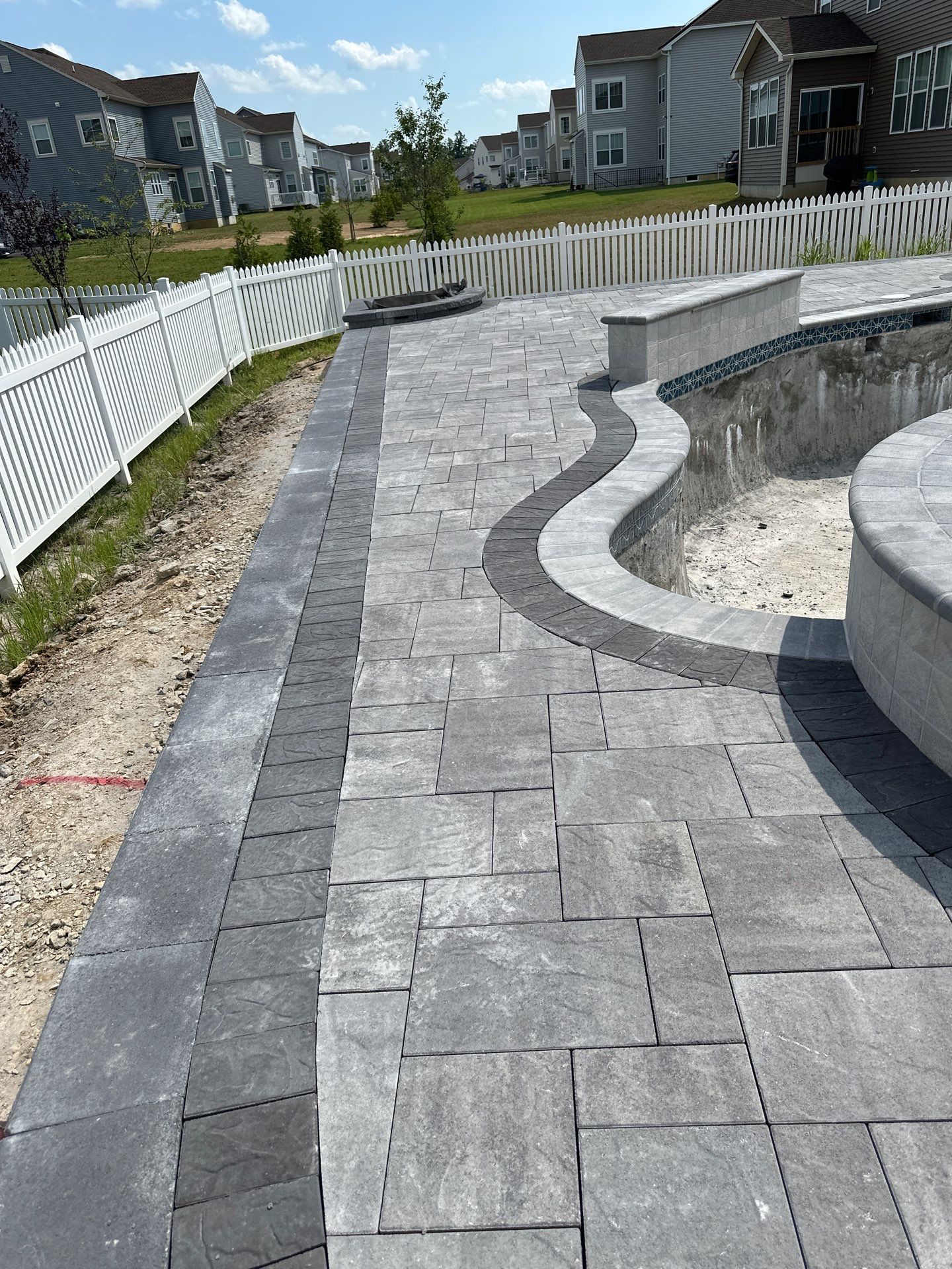 Pool and Hardscape Design in Delaware | Belgard Paver Patio & Outdoor Living Space by Studio G Indoor Spaces & Outdoor Living
