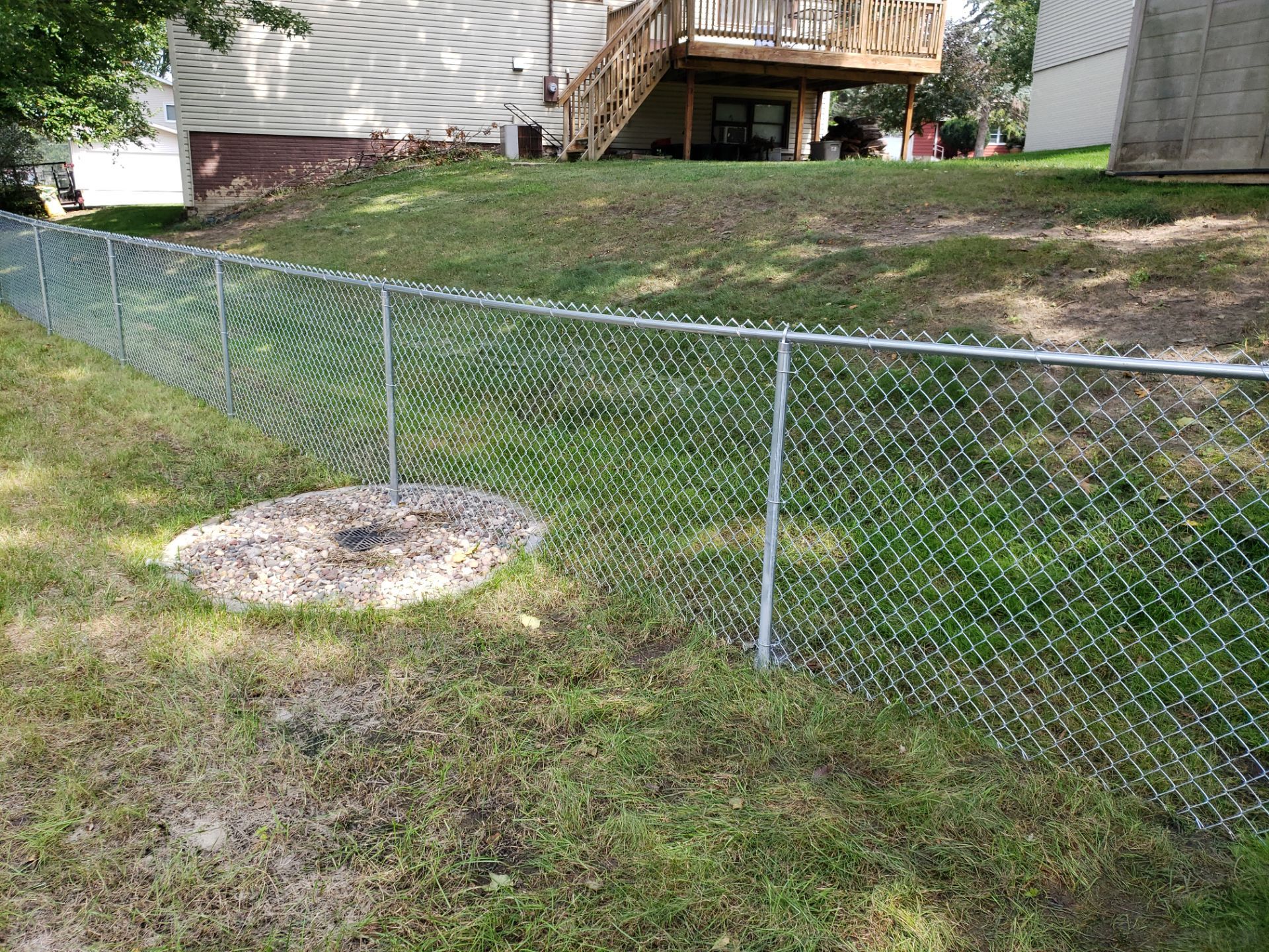 Galvanized Chain Link Backyard Fence and Gate Installation in Cedar Falls by Perfect Picket Fence and Stain