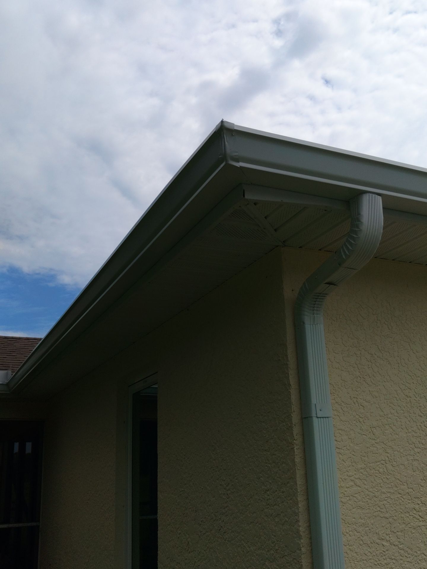 Seamless gutters in Lehigh Acres, FL provide a strong and efficient solution for managing heavy Florida rainfall by Gutter Professors