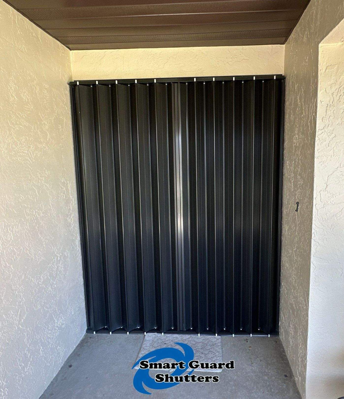 Accordion Shutter in Bronze by Smart Guard Shutters