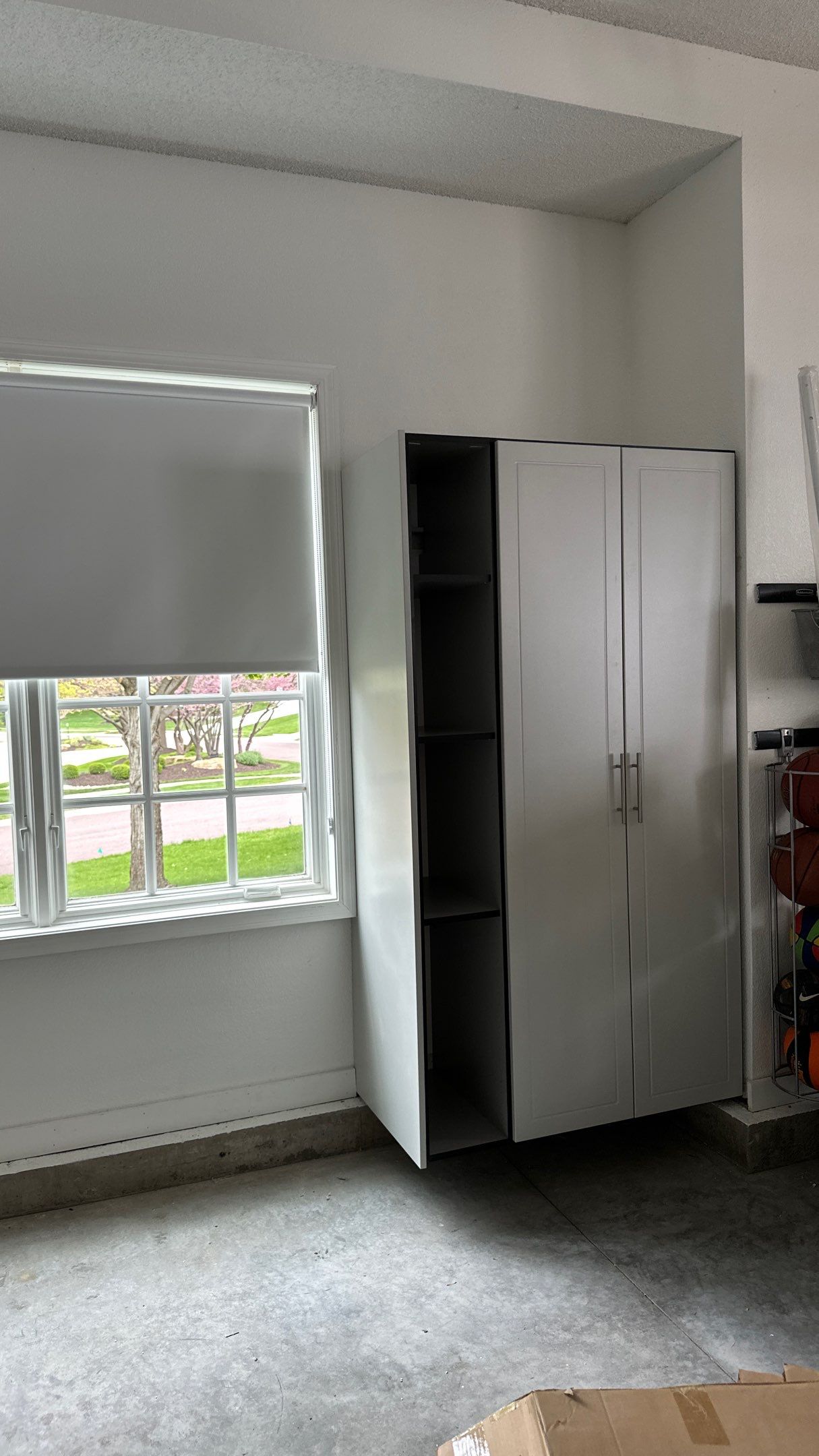 Brooke L. added cabinets for a clean storage look by Banner Garage