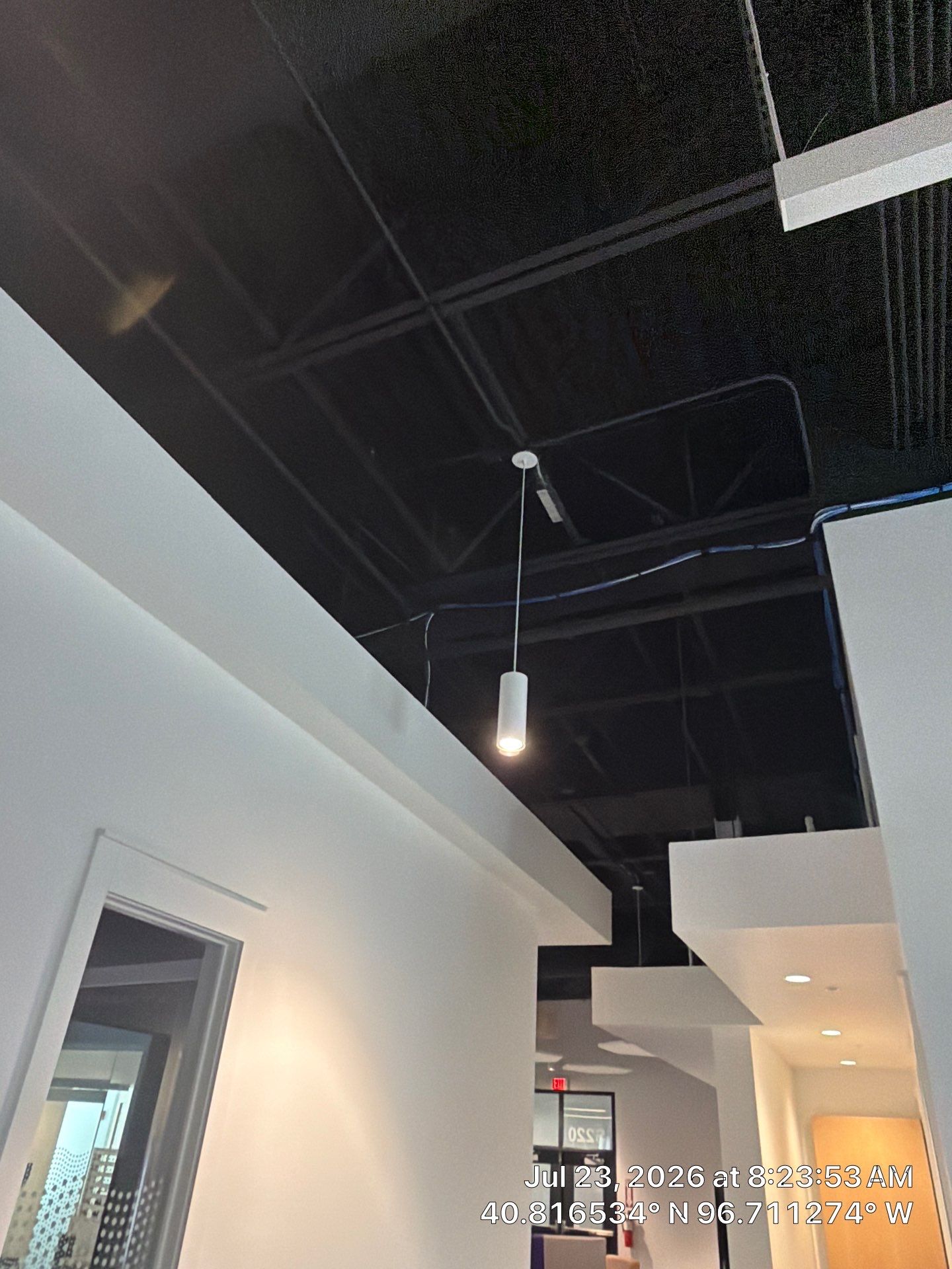Lincoln Commercial Office Remodel with Glass Doors and Acoustic Baffles by CompanyCam Sales Demo