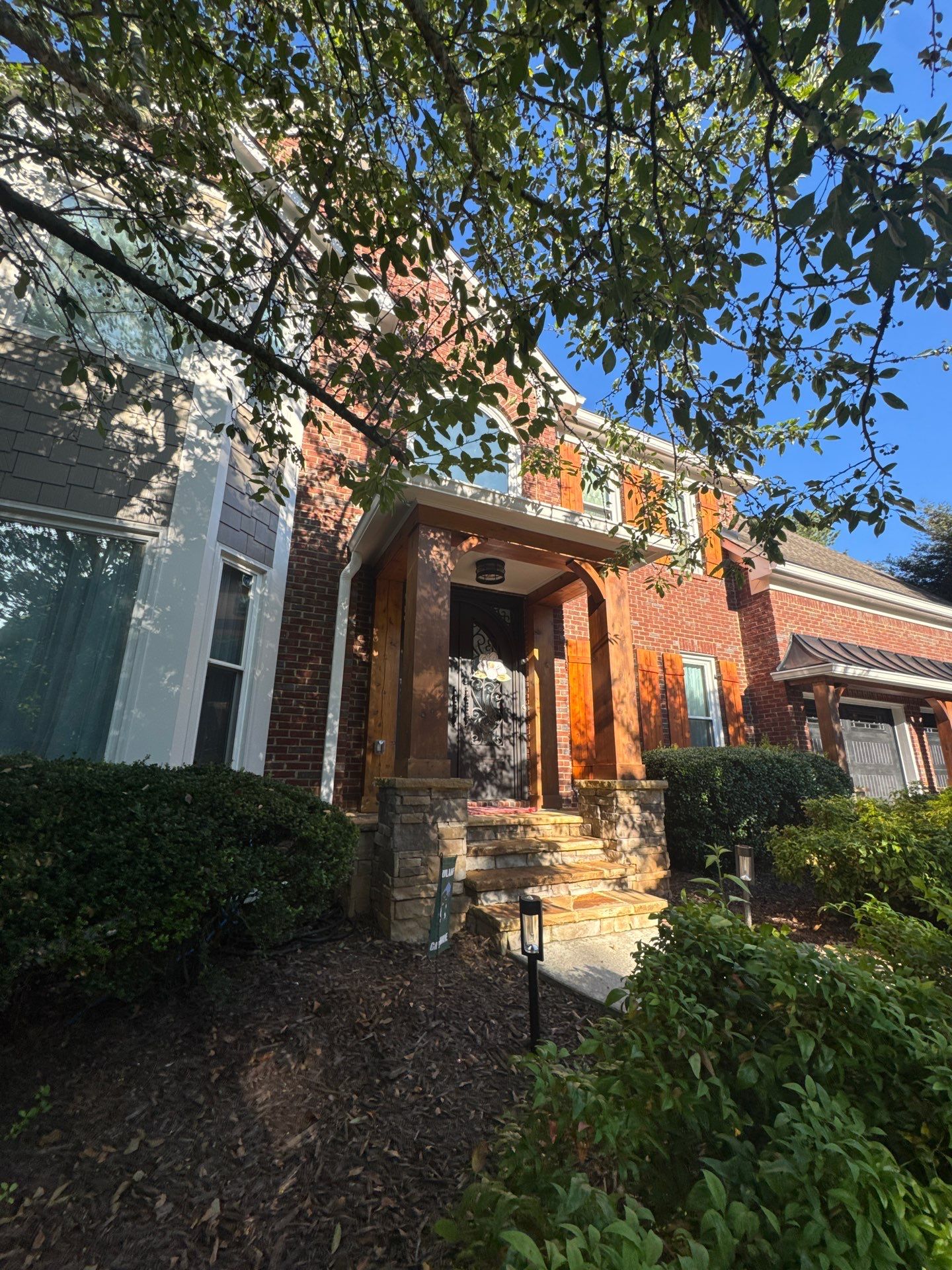Exterior Modernization Featuring New Siding and Custom Wood Portico by Swift Home Renovations